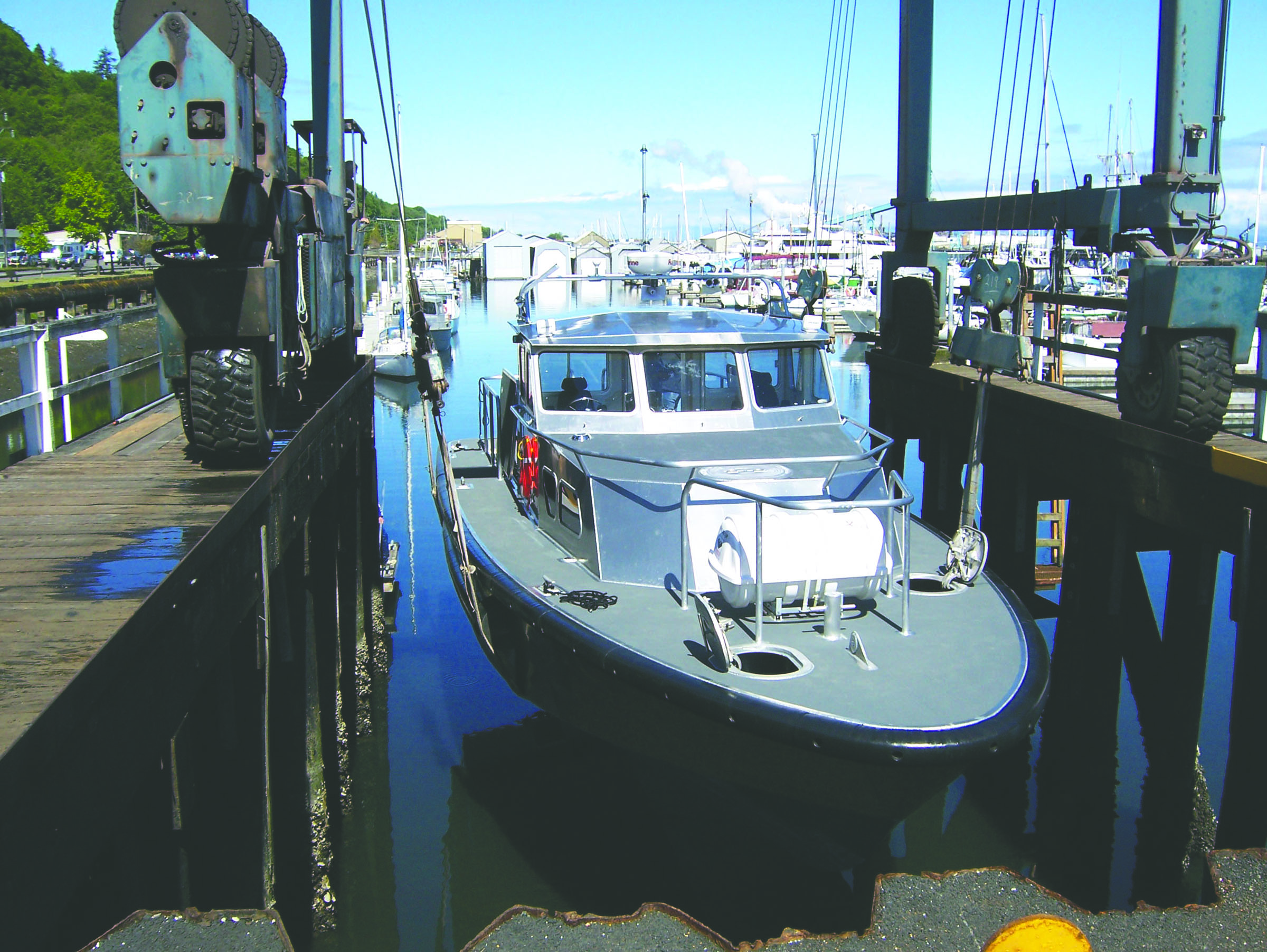 The UB45-1 from Lee Shore Boats is placed into the water in Port Angeles.  -- Photo by David G. Sellars/for Peninsula Daily News