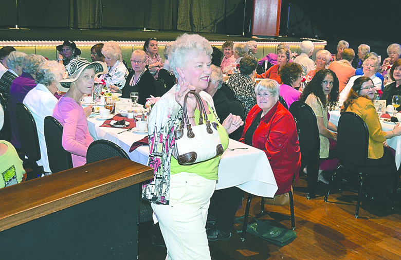 Dianne Mcintosh with the purse she carried as part of a $21 outfit she modeled during the Sequim-Dungeness Hospital Guild's annual luncheon fashion show at 7 Cedars Casino. Joe Smillie/Peninsula Daily News