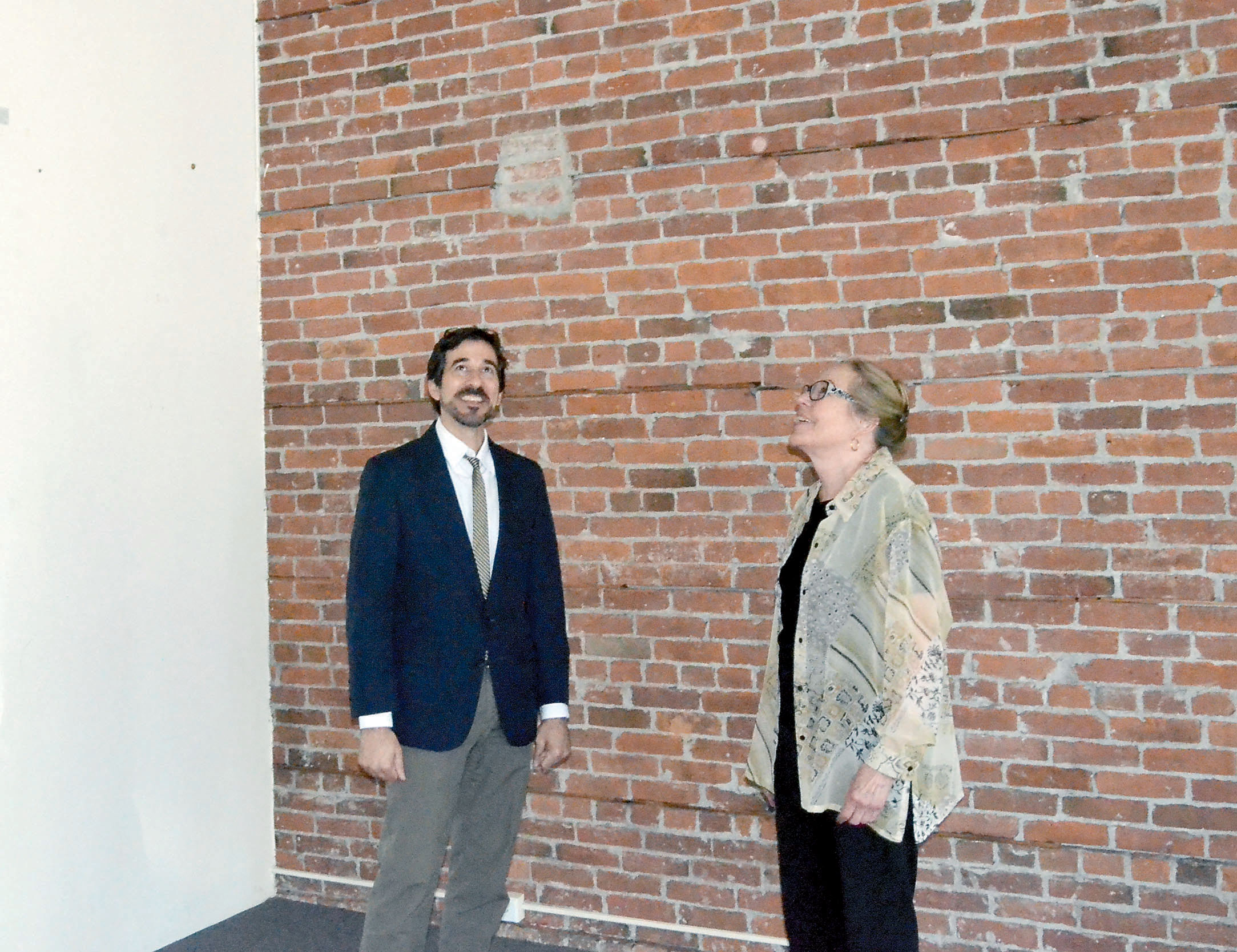 Northwind Arts Center Executive Director Michael D’Alessandro and board chair Jeanette Best inspect the new downtown Port Townsend space the gallery hopes to take over in October. — Charlie Bermant/Peninsula Daily News