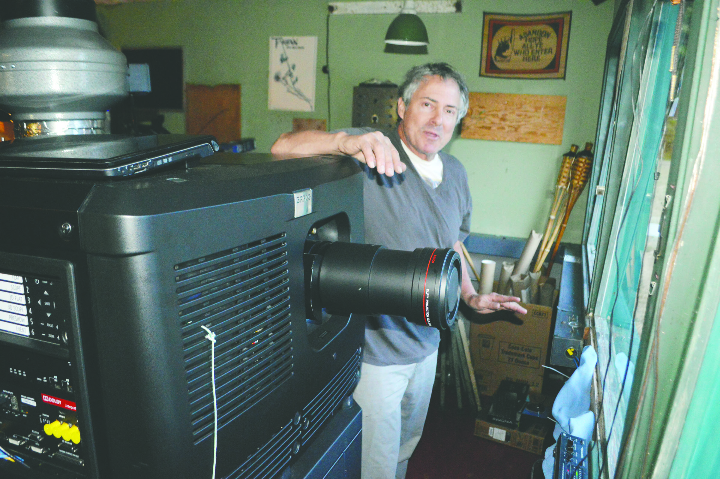 Wheel-In Motor Movie owner Rick Wiley shows off the new Barco PP2k-23B digital movie projector he has installed at the Port Townsend drive-in movie theater with the help of a Kickstarter campaign in which fans of the theater contributed more than $35