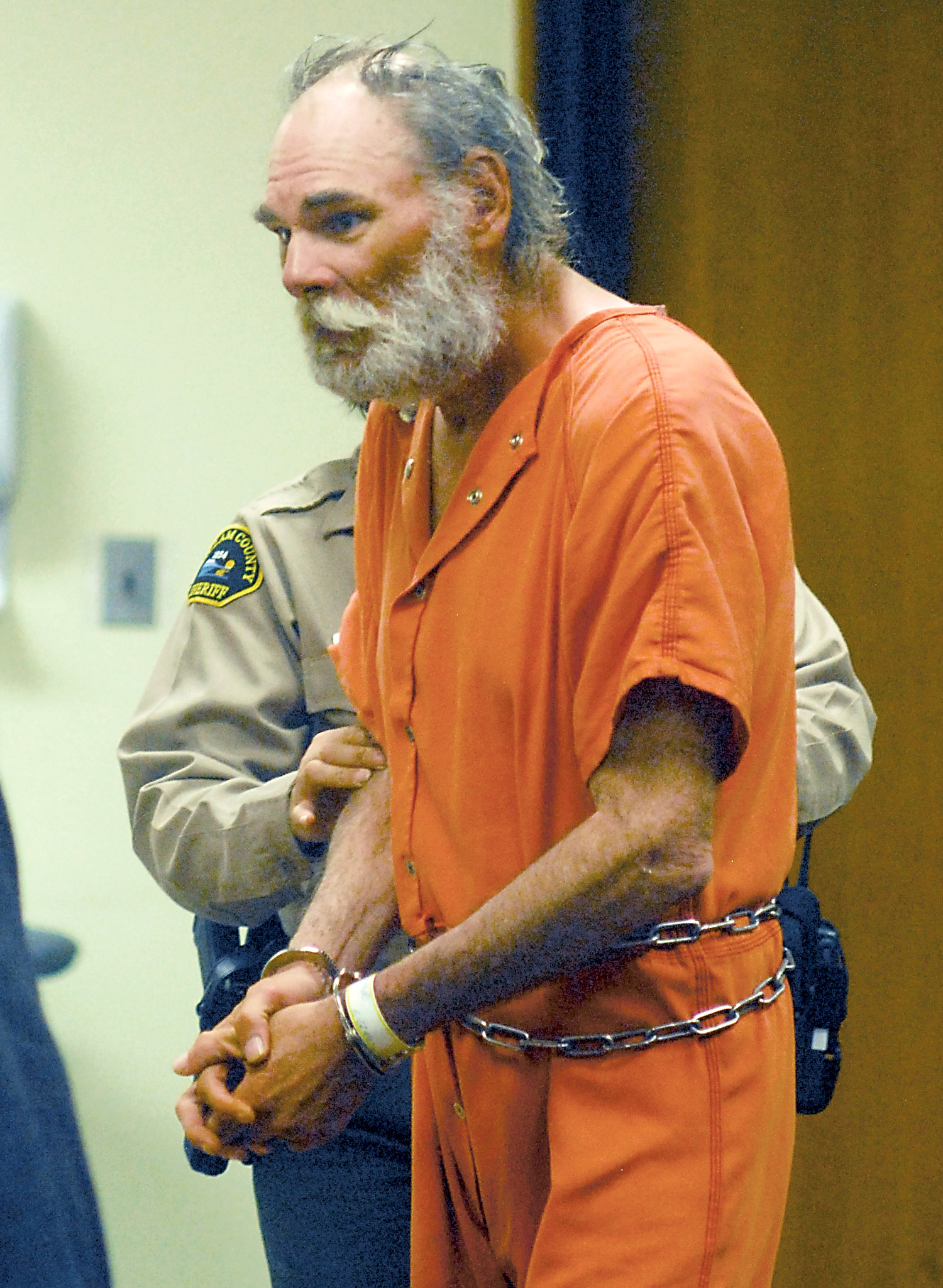 Arthur Delfield Crall is escorted into Clallam County Superior Court in Port Angeles on Wednesday. Keith Thorpe/Peninsula Daily News