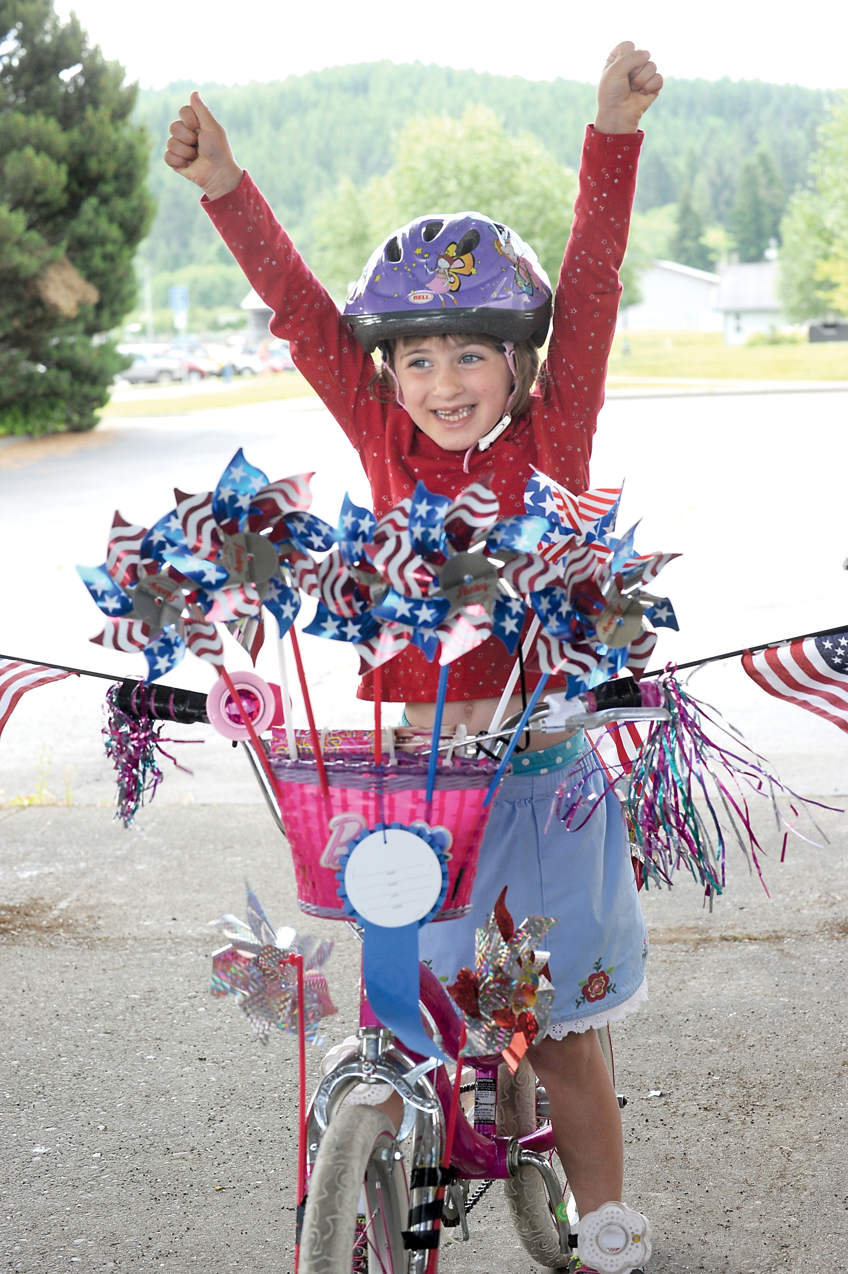 Julie Anne Haag of Forks signals that she's ready for the Kiddies Parade in 2013. —Photo by Lonnie Archibald/for Peninsula Daily News