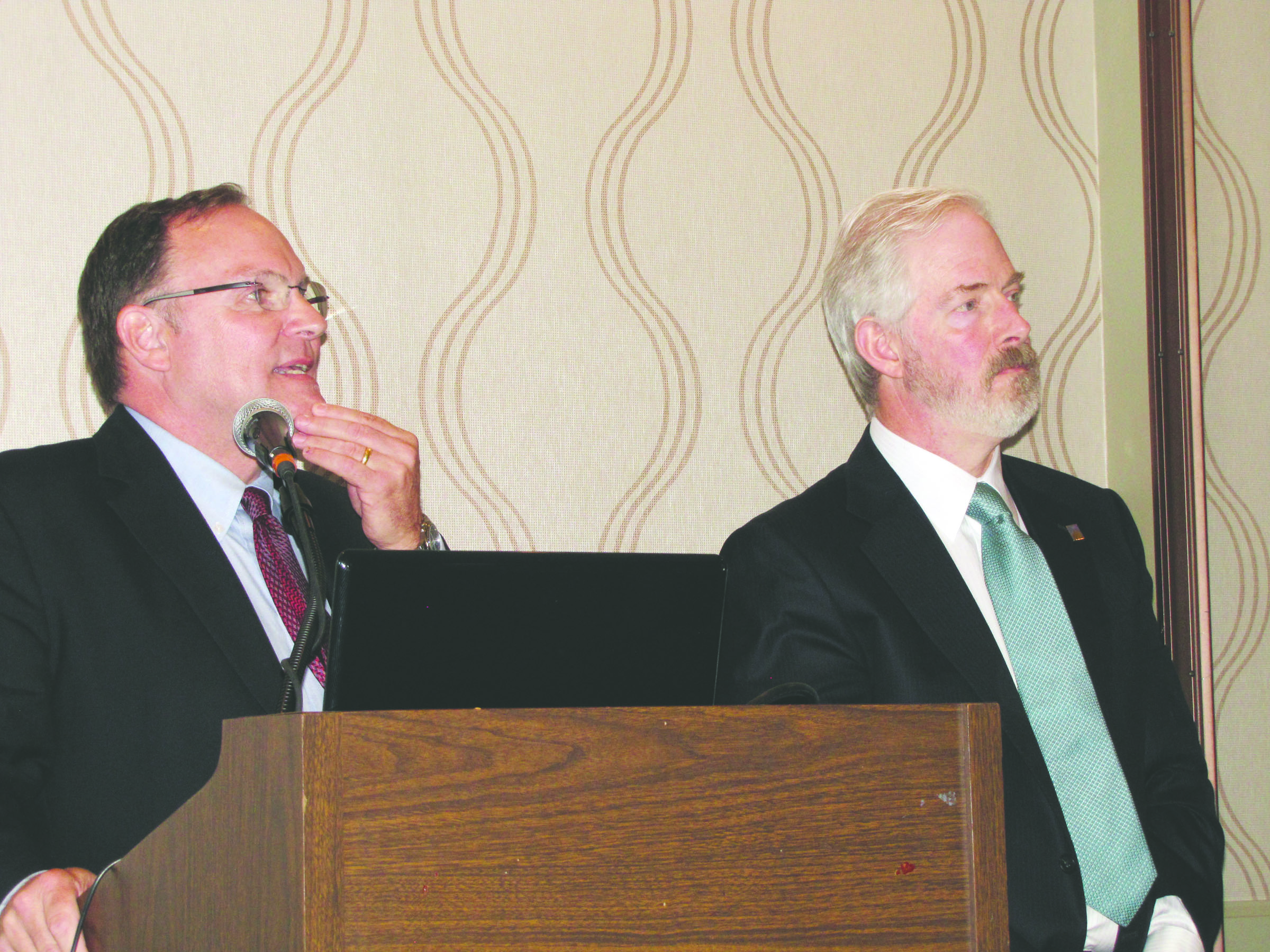 Port of Port Angeles Executive Director Ken O’Hollaren answers a question as Commissioner Jim Hallett listens during a presentation on the port’s economic impact study at the Port Angeles Regional Chamber of Commerce meeting Monday. — Arwyn Rice/Peninsula Daily News