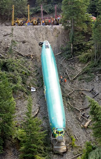 Crews pull up one of three Boeing 737 fuselages from the Clark Fork River in Montana.  —Photo by The Associated Press