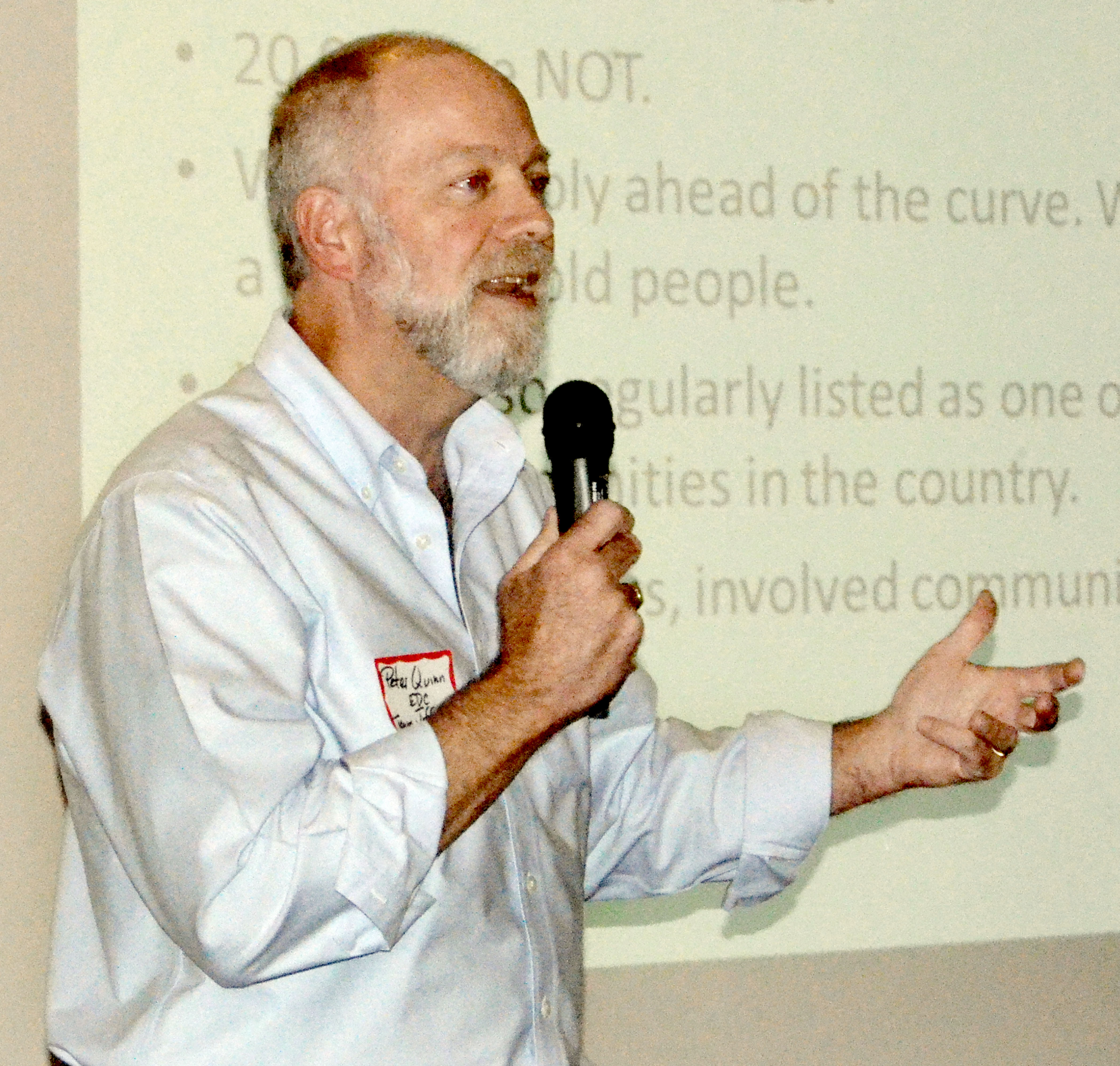 Peter Quinn speaks to the Jefferson County Chamber of Commerce on Monday. —Photo by Charlie Bermant/Peninsula Daily News