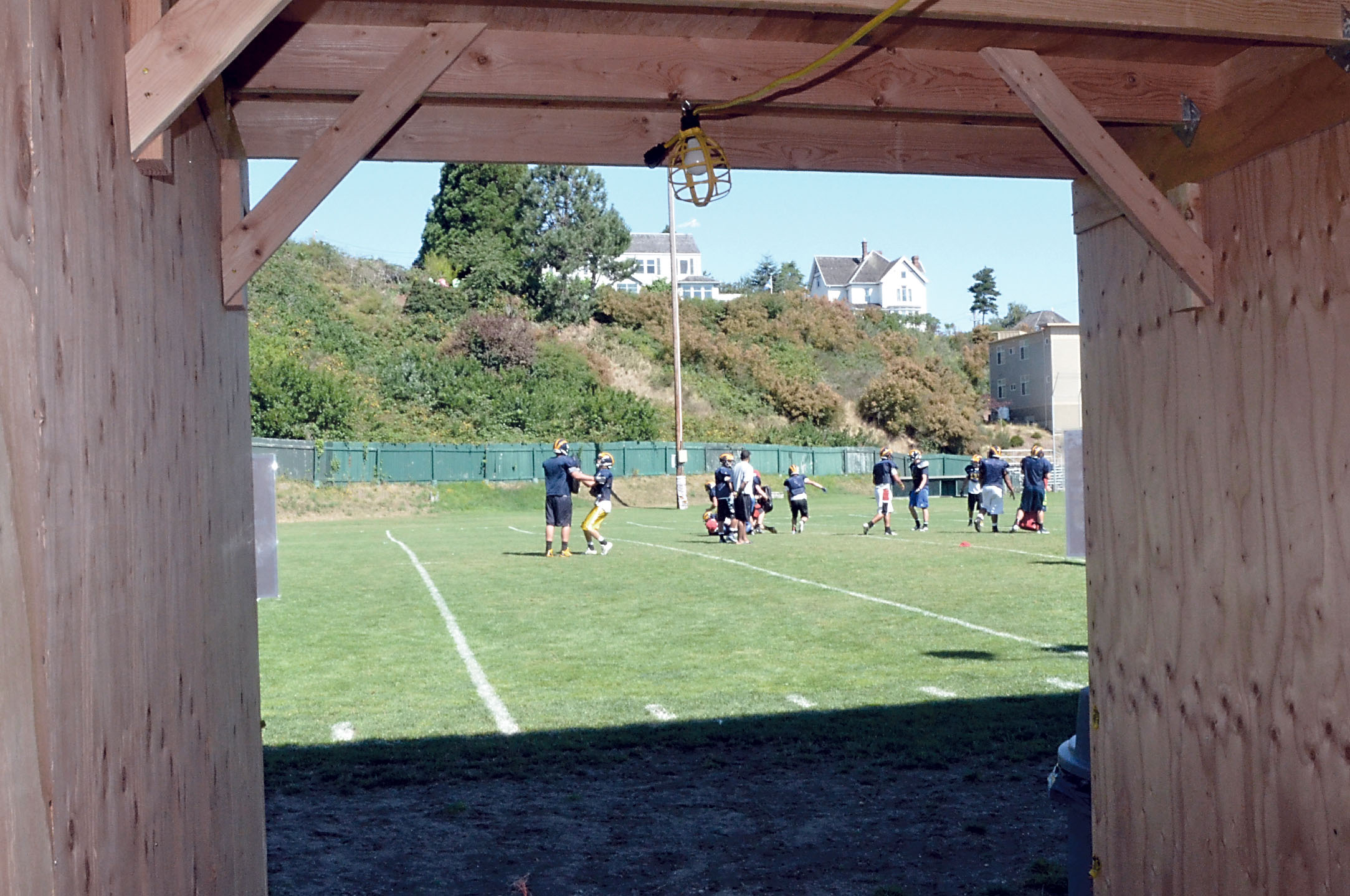 A temporary wooden tunnel opens out onto Memorial Field in Port Townsend.  —Photo by Charlie Bermant/Peninsula Daily News