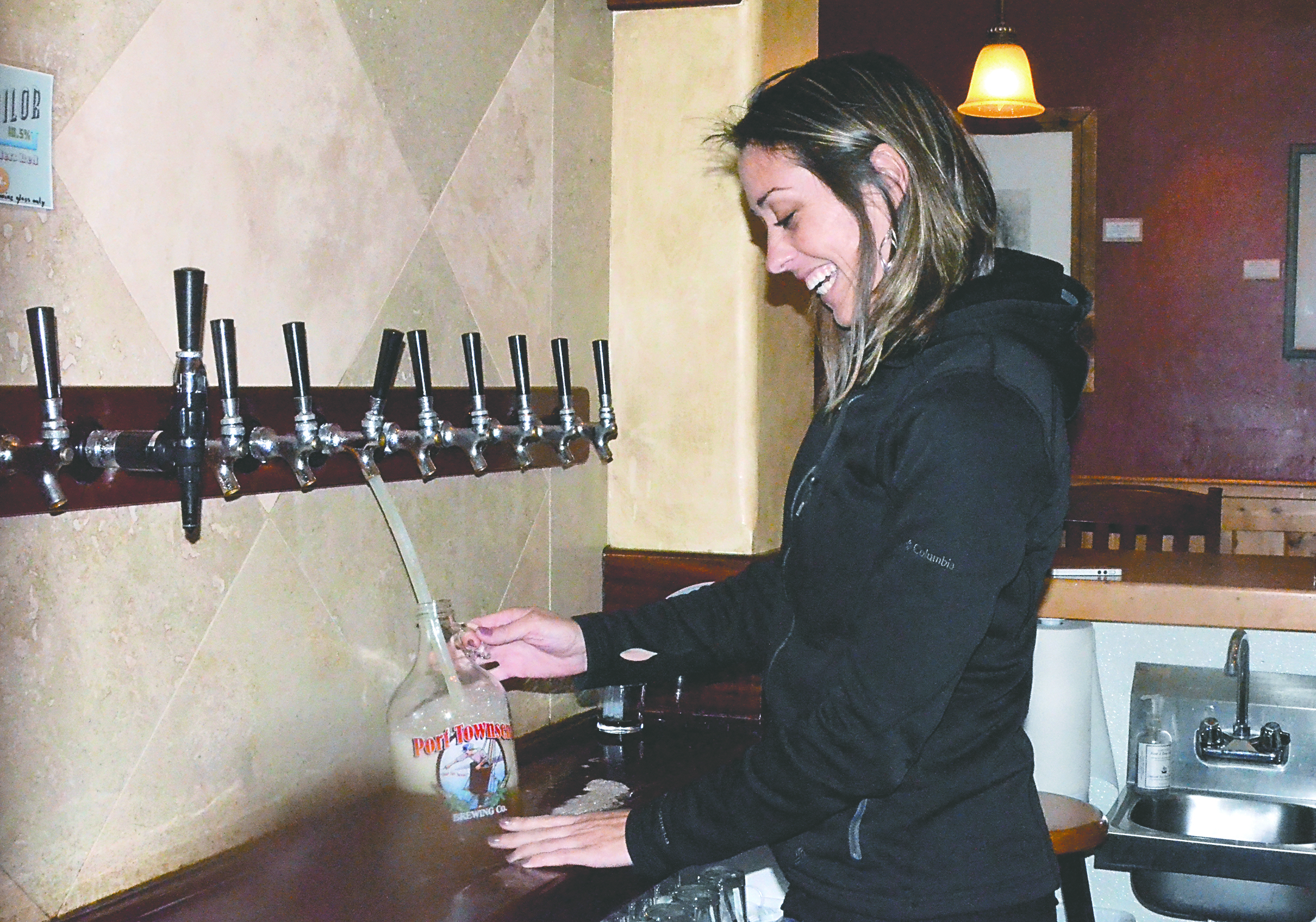 Erin O'Meara pours a growler at the Port Townsend Brewing Co.