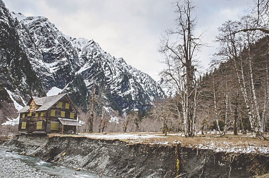 The Enchanted Valley Chalet will be moved a short distance to give Olympic National Park more time to develop a permanent solution to the structure being undercut by the East Fork Quinault River. National Park Service