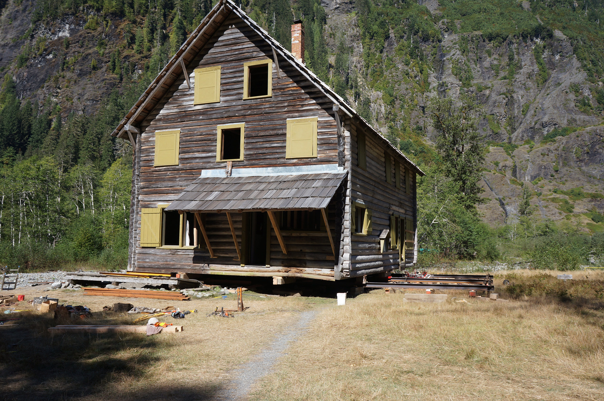 The Enchanted Valley chalet rests on steel beams during work to push the structure back from the banks of the Quinault River earlier this month. National Park Service