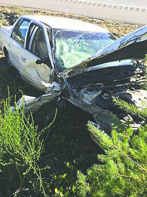 Six people were hurt when this Cadillac and a Volkswagen Vanagon collided on state Highway 104 on Saturday afternoon. Brad Martin