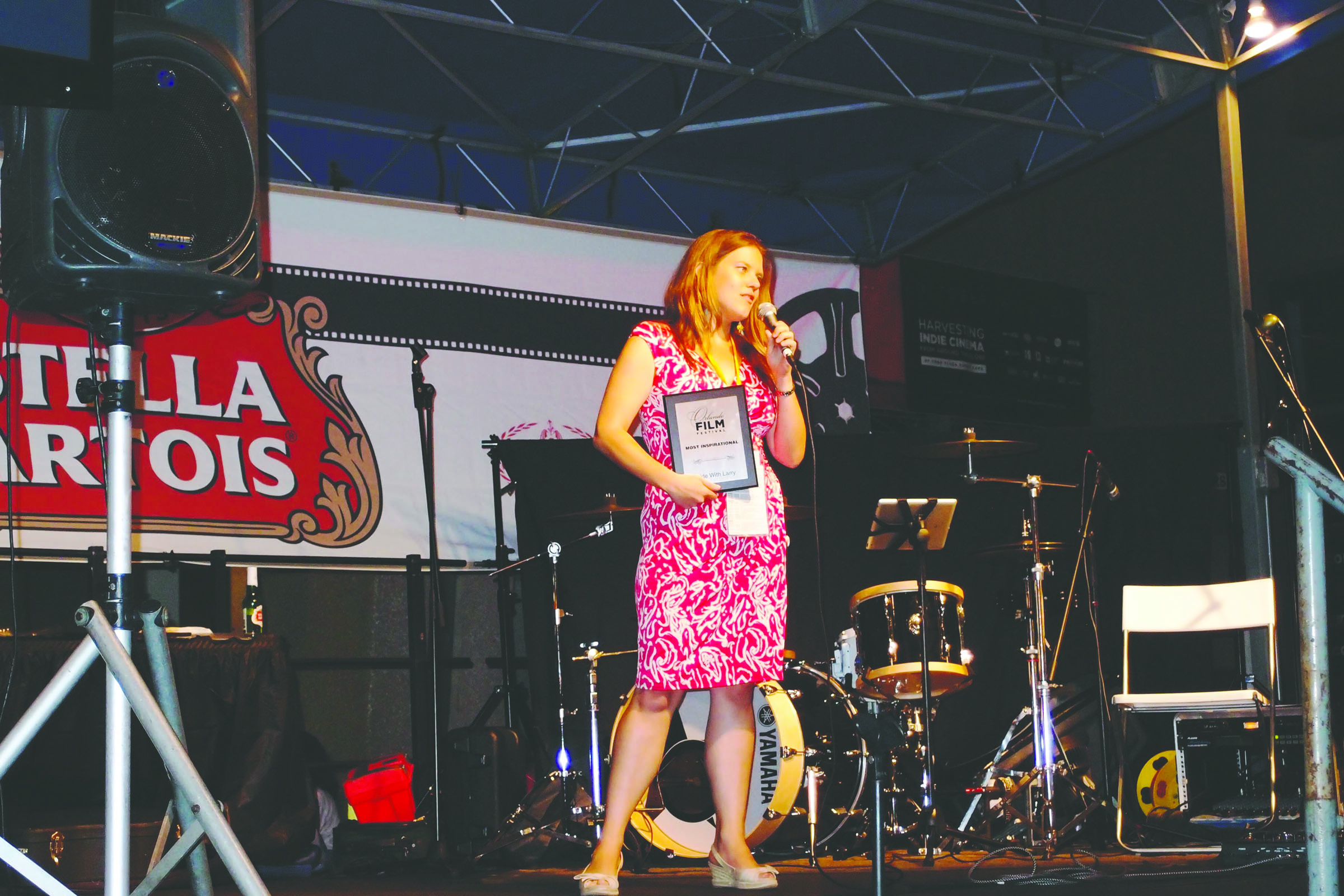 Katie Skow addresses Orlando International Film Festival after “Ride With Larry” received the festival's audience choice award.