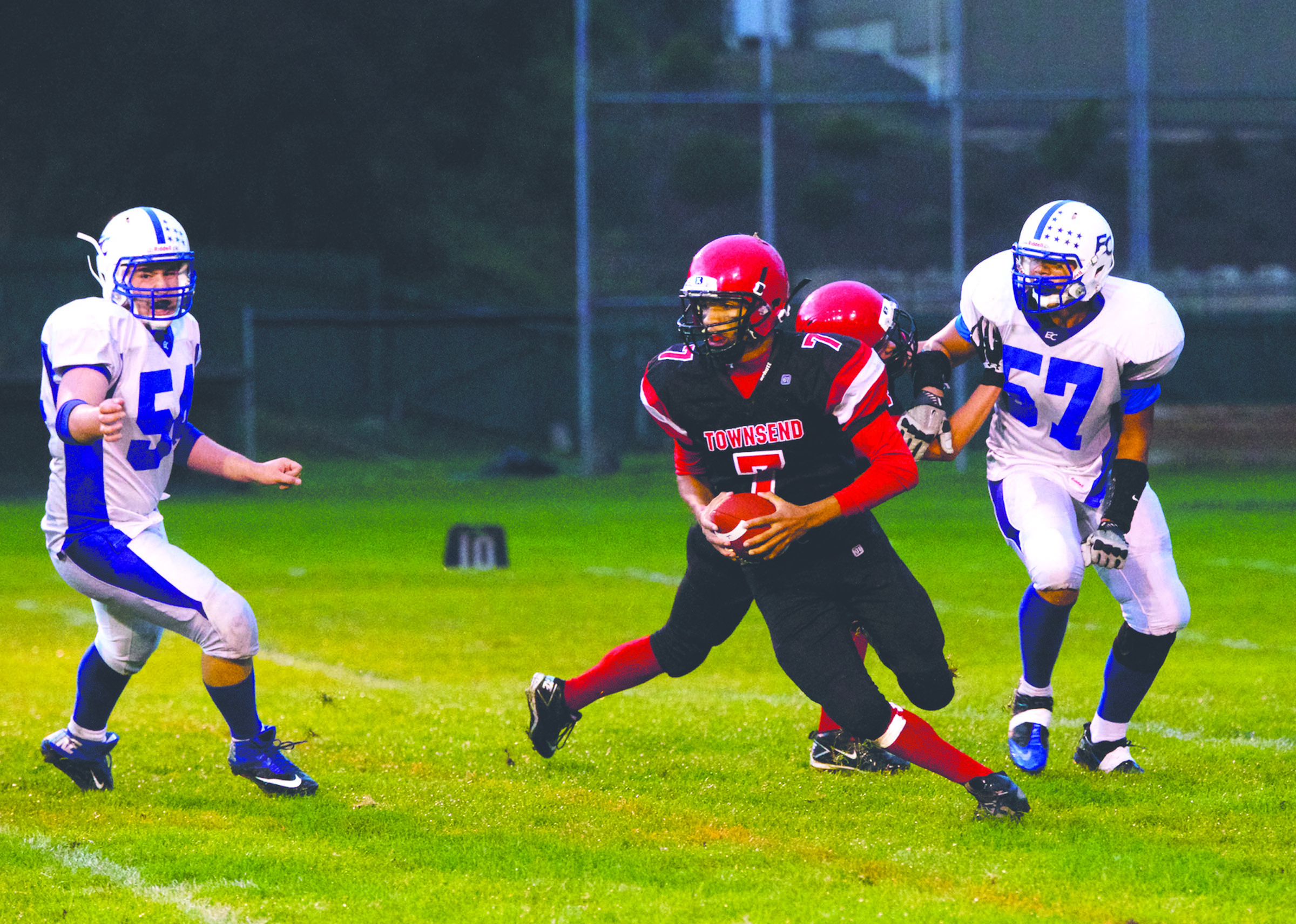 Port Townsend quarterback Jacob King looks to make a play downfield against the Eatonville defense at Memorial Field in Port Townsend. Photo -- Steve Mullensky/for Peninsula Daily News