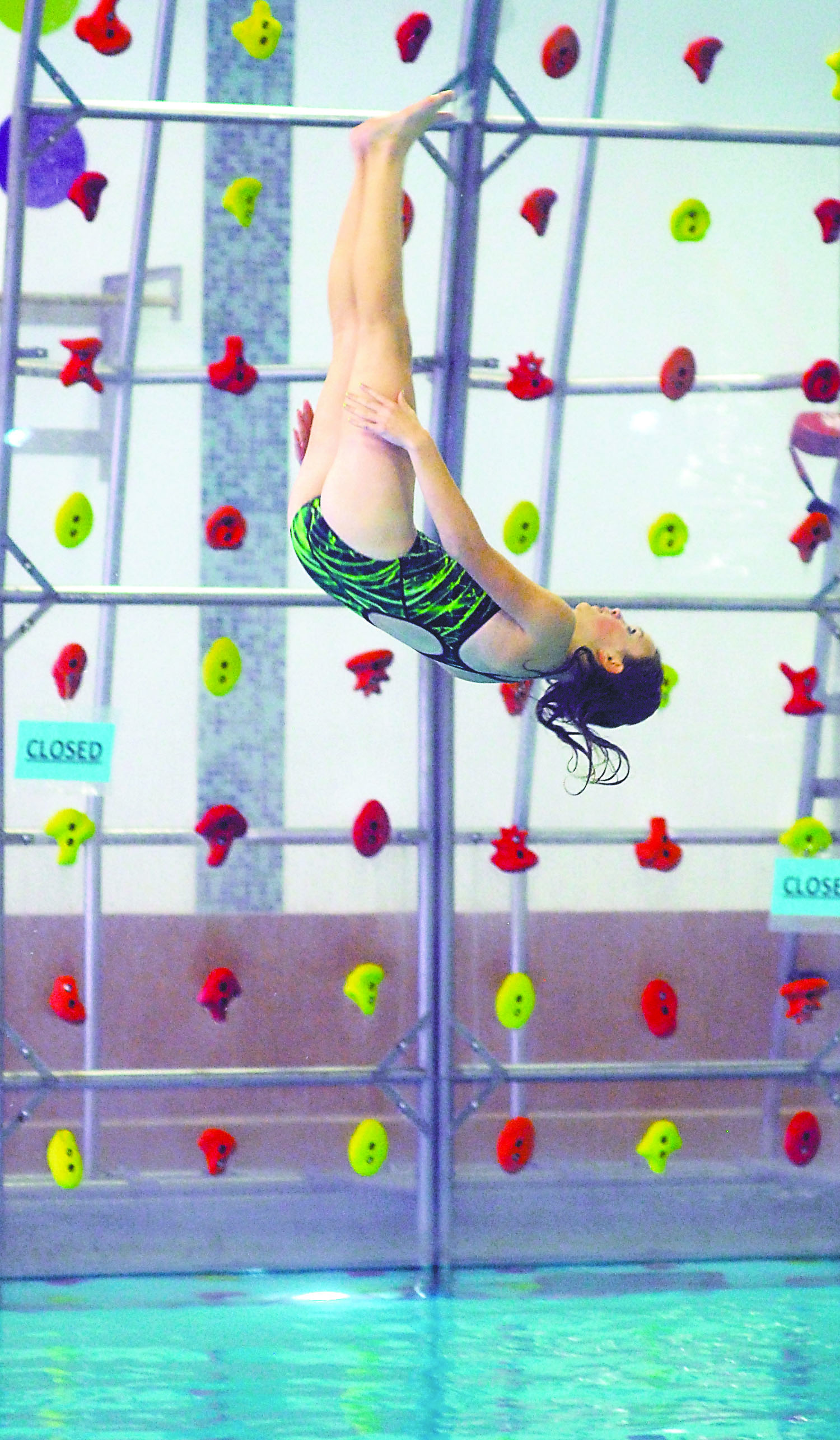 Haili Farnam of Port Angeles dives during a meet against Bainbridge at William Shore Memorial Pool. Keith Thorpe/Peninsula Daily News