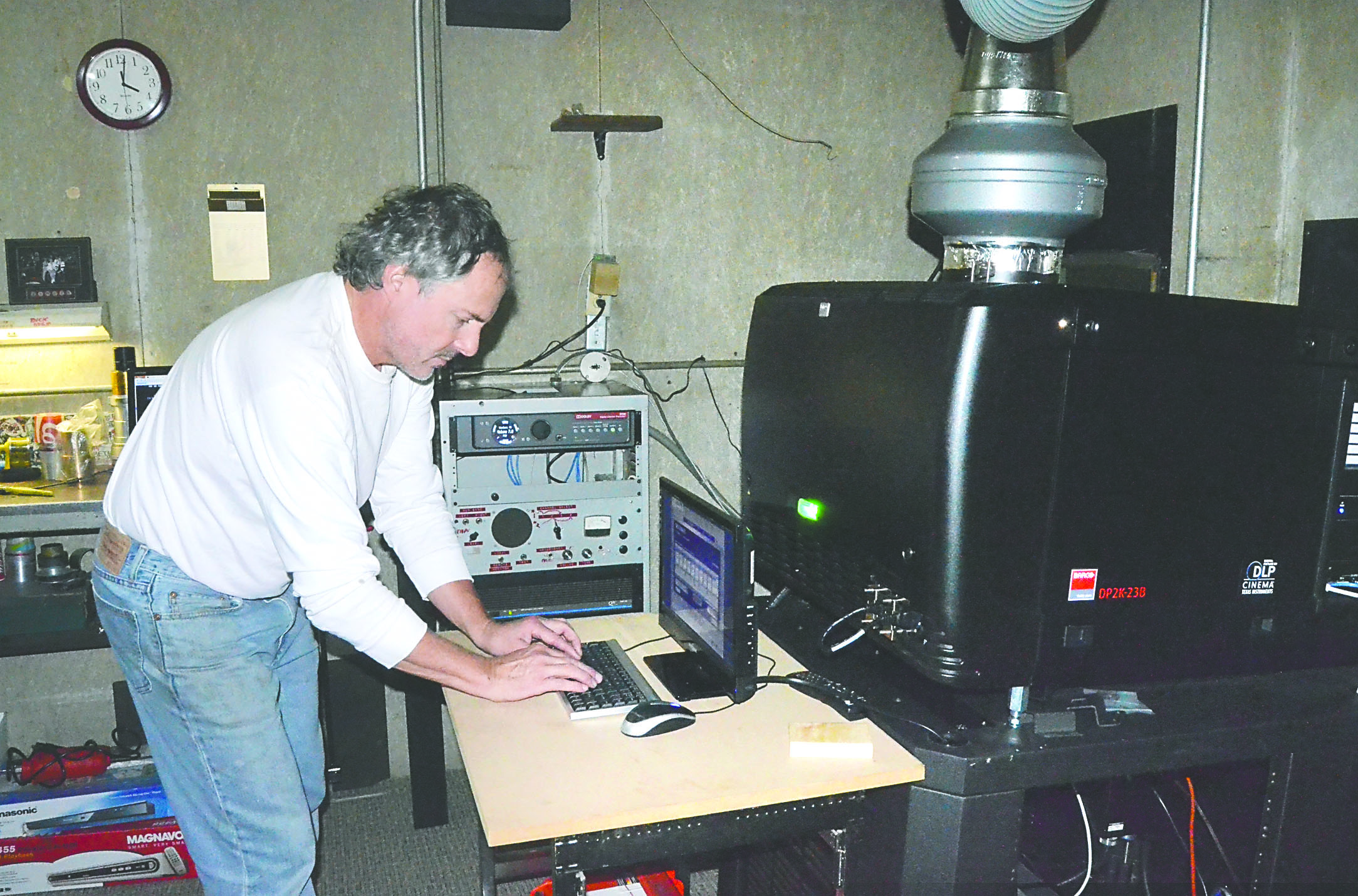 Uptown Theatre owner Rick Wiley operates the newly installed digital projector at the Port Townsend cinema. — Photo by Charlie Bermant/Peninsula Daily News