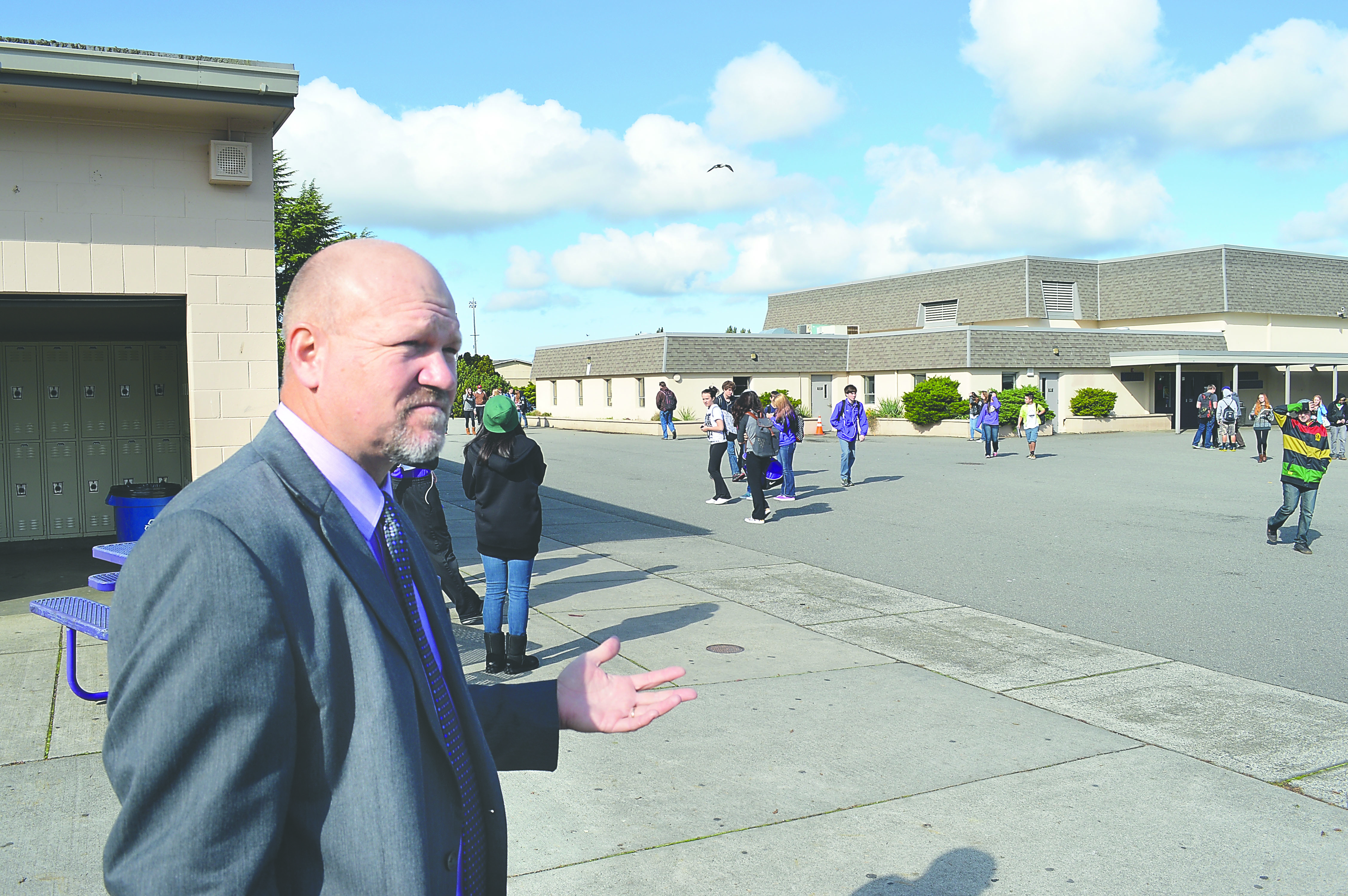 Students move around Sequim High School as Superintendent Kelly Shea discusses the difficulties of keeping track of students on the open campus. A panel is looking at how growth will affect Sequim schools.  -- Photo by Joe Smillie/Peninsula Daily News