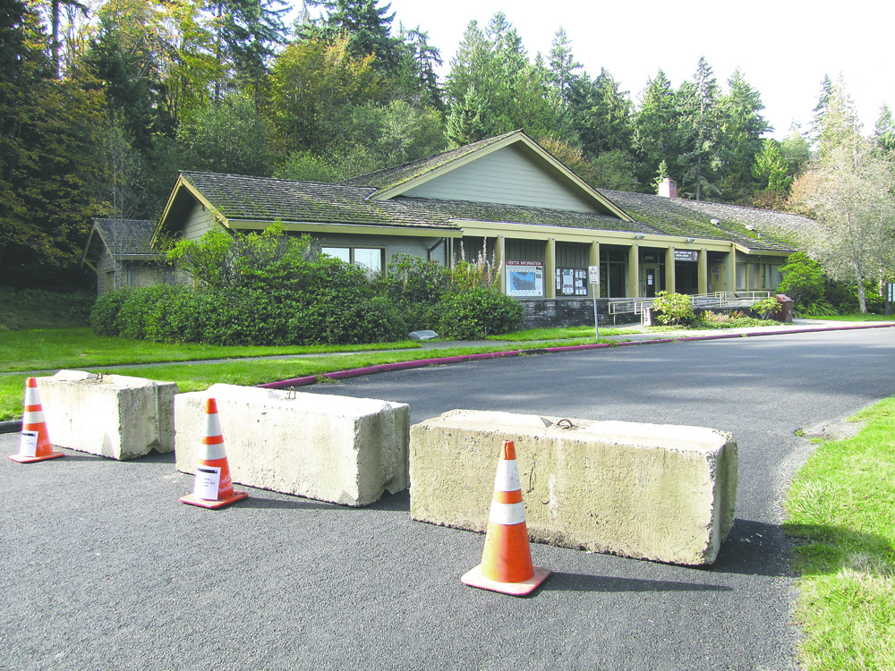 Concrete barriers block the driveway to the Olympic National Park Visitor Center on Mount Angeles Road in Port Angeles this week. Arwyn Rice/Peninsula Daily News