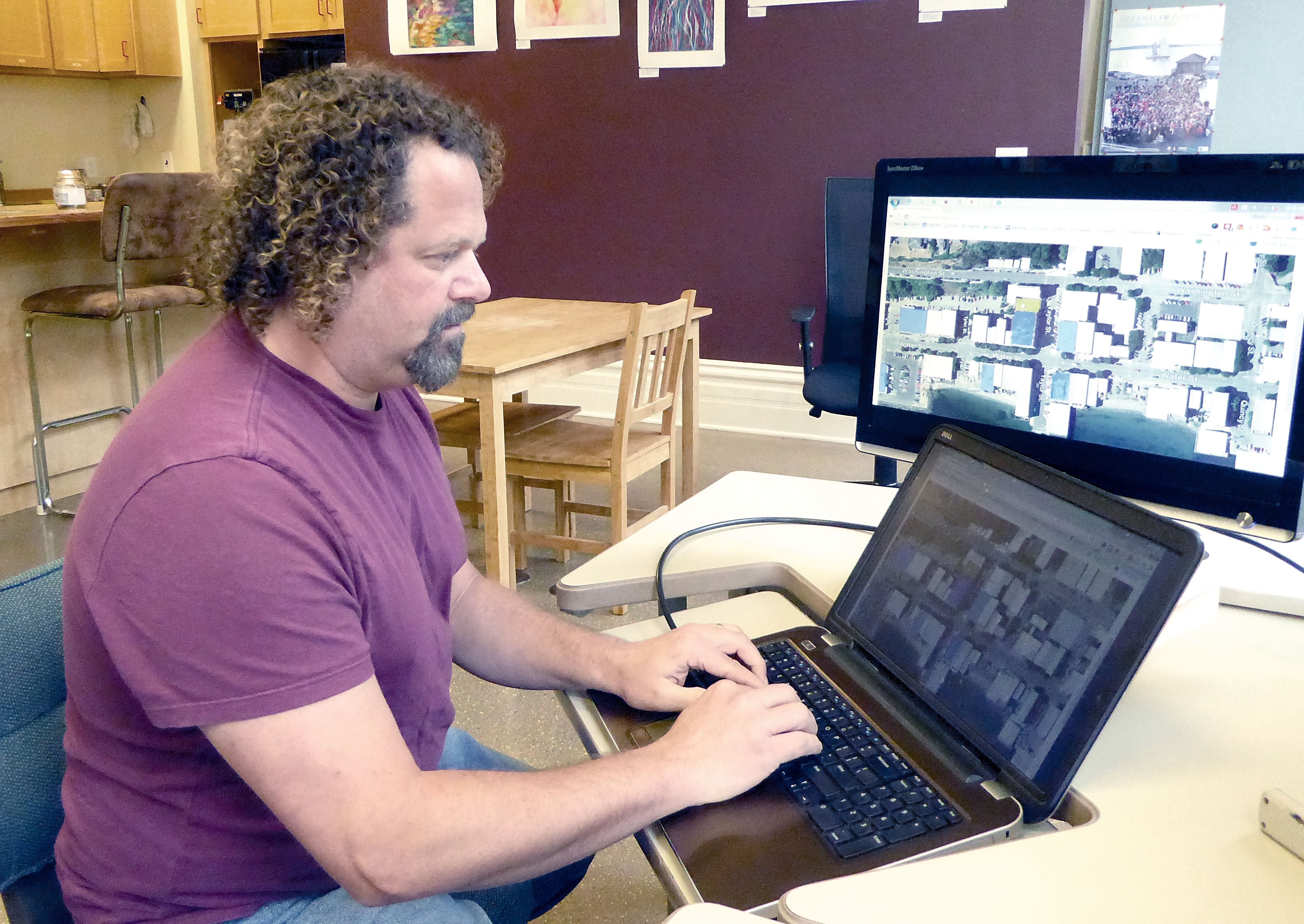 Web designer Frank DePalma said he is always adding new information to the downtown business inventory site which is sponsored by the Port Townsend Main Street Program. Charlie Bermant/Peninsula Daily News