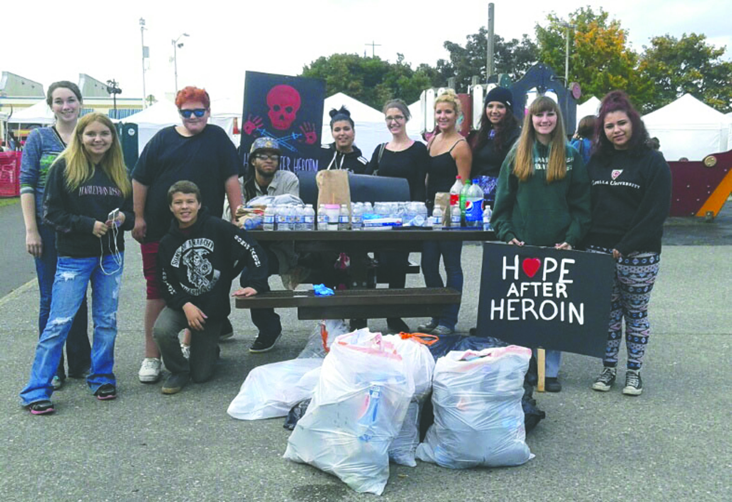 Twenty-three Port Angeles students took part in a cleanup effort Friday in downtown Port Angeles. Tina Sperry