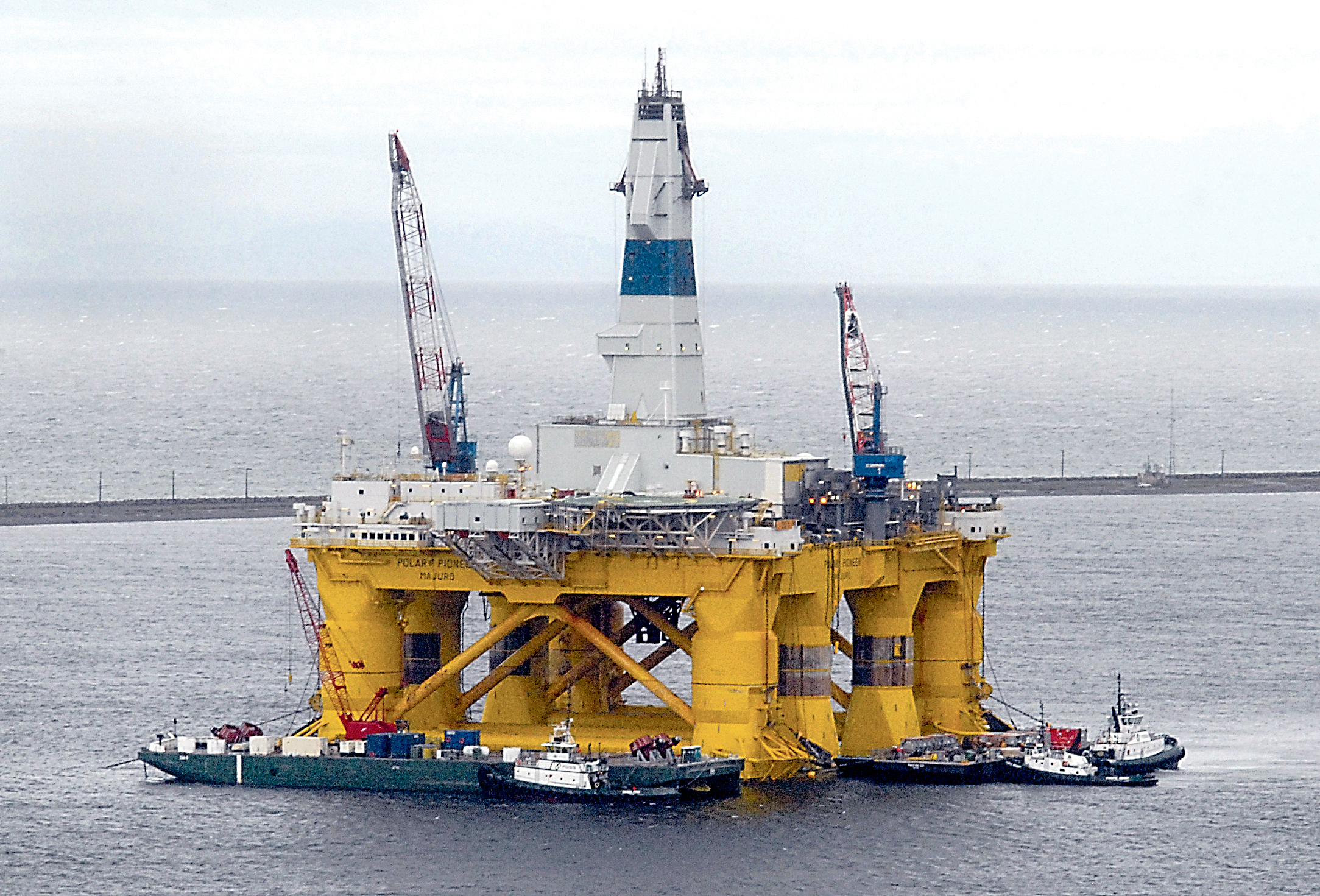 The offshore oil platform Polar Pioneer is surrounded by support vessels April 29 in Port Angeles Harbor in preparation for being towed to Seattle. Keith Thorpe/Peninsula Daily News