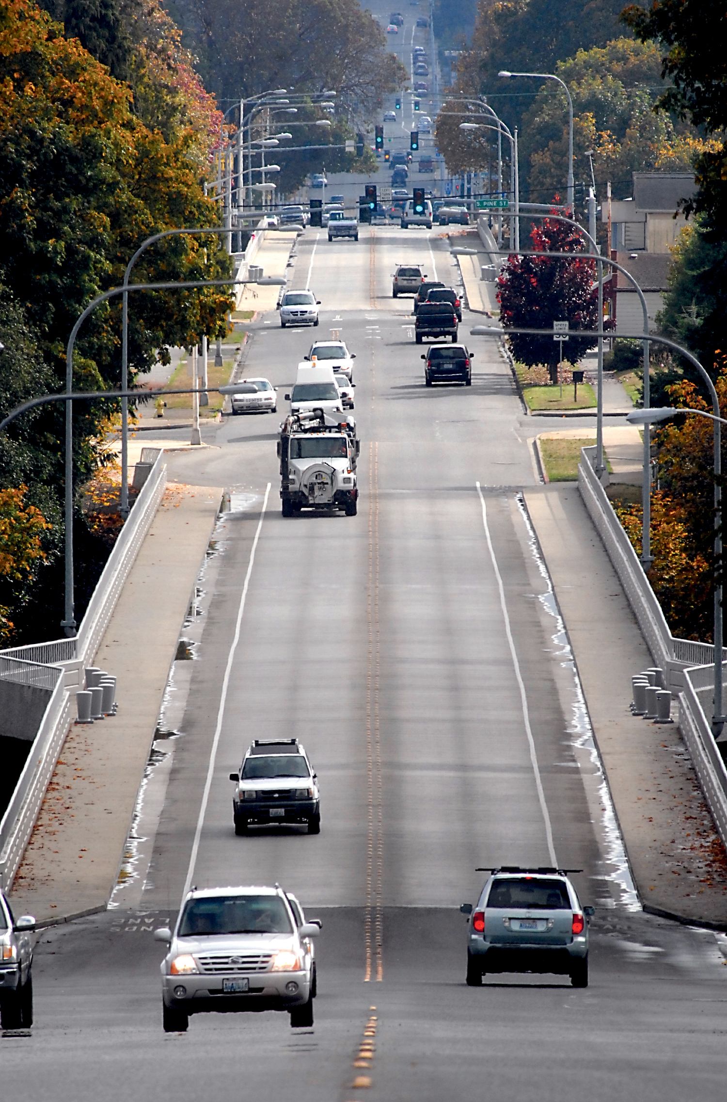 Traffic flows across the two towering Eighth Street bridges crossing Tumwater