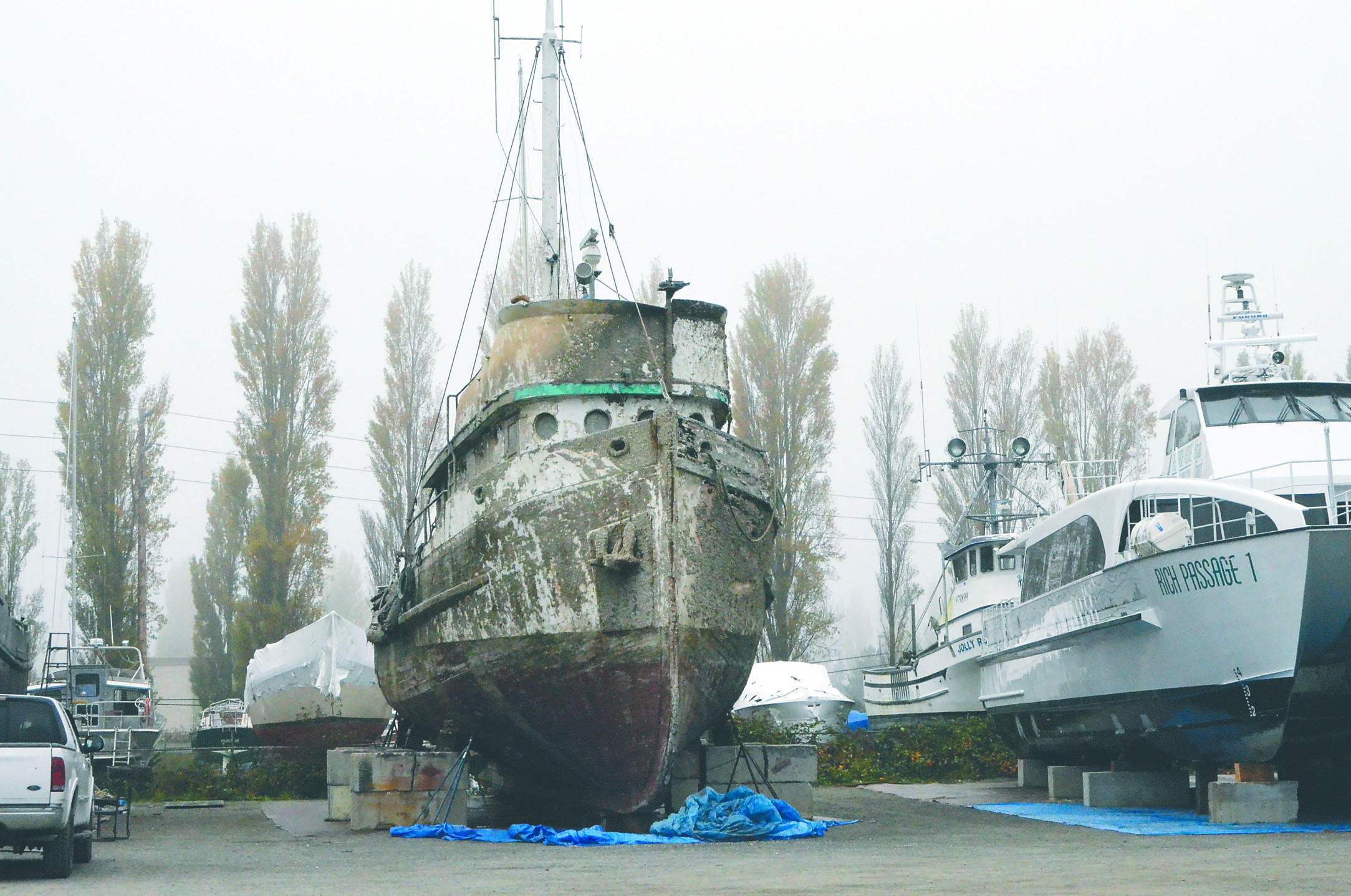 The Western Flyer sits on blocks in the Port Townsend Boat Haven boatyard