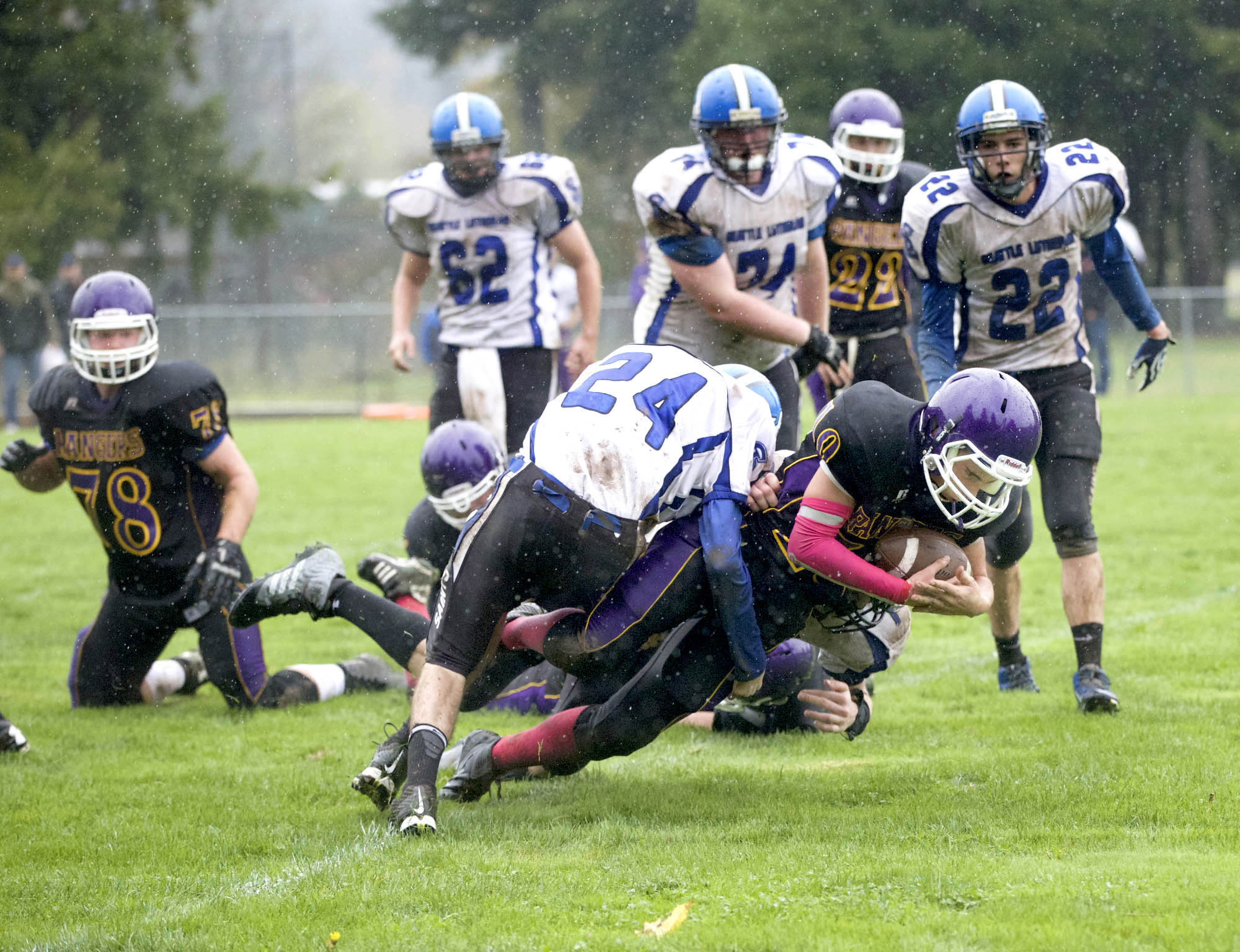 Quilcene's A.J. Prater falls across the goal line for one of his touchdowns during the Rangers 34-6 home win over Seattle Lutheran. Quilcene has a week off before the start of the Quad-District playoffs. Steve Mullensky/for Peninsula Daily News