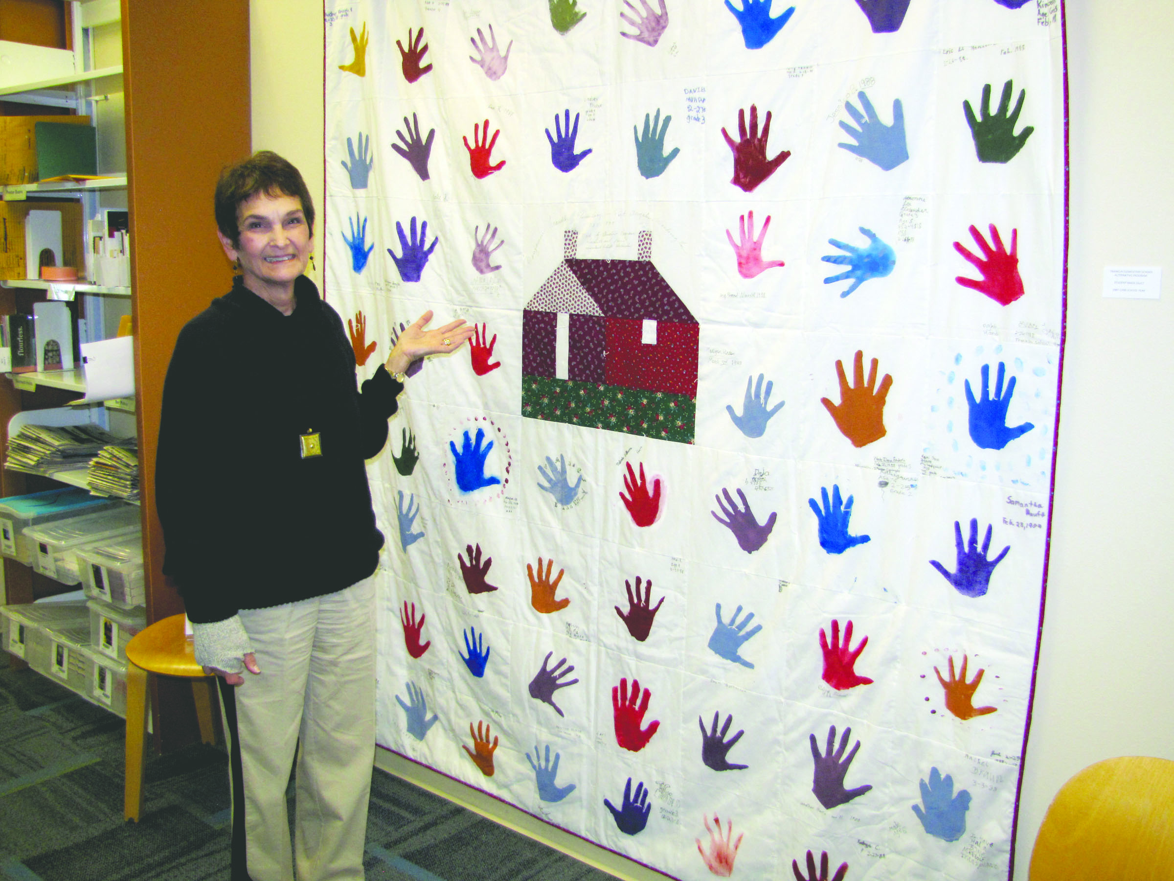 Laurie Reeve of Port Angeles examines her 1988 quilt