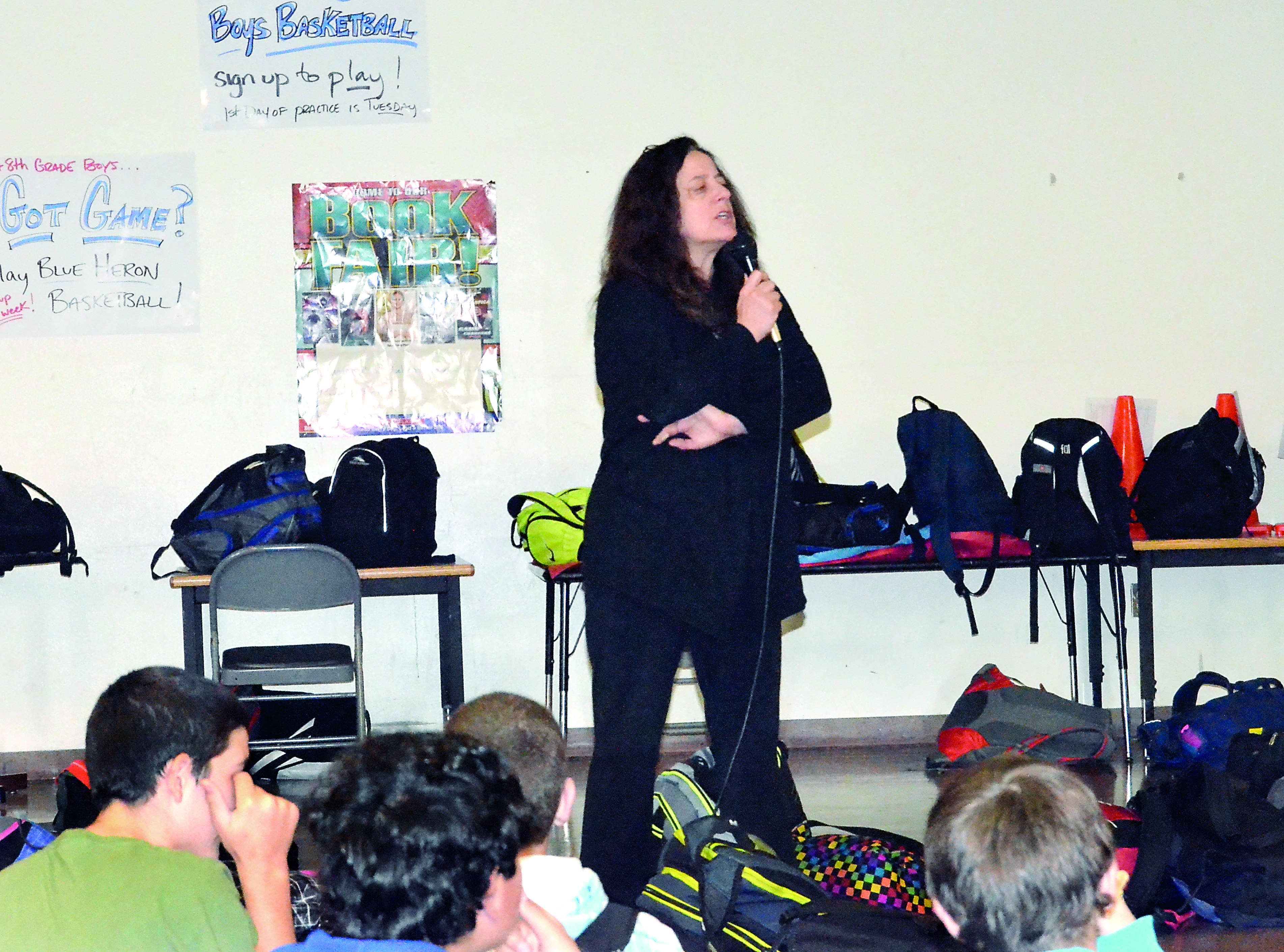 Blue Heron Middle School Principal Diane Lashinsky addresses students Wednesday about the investigation of a gun threat