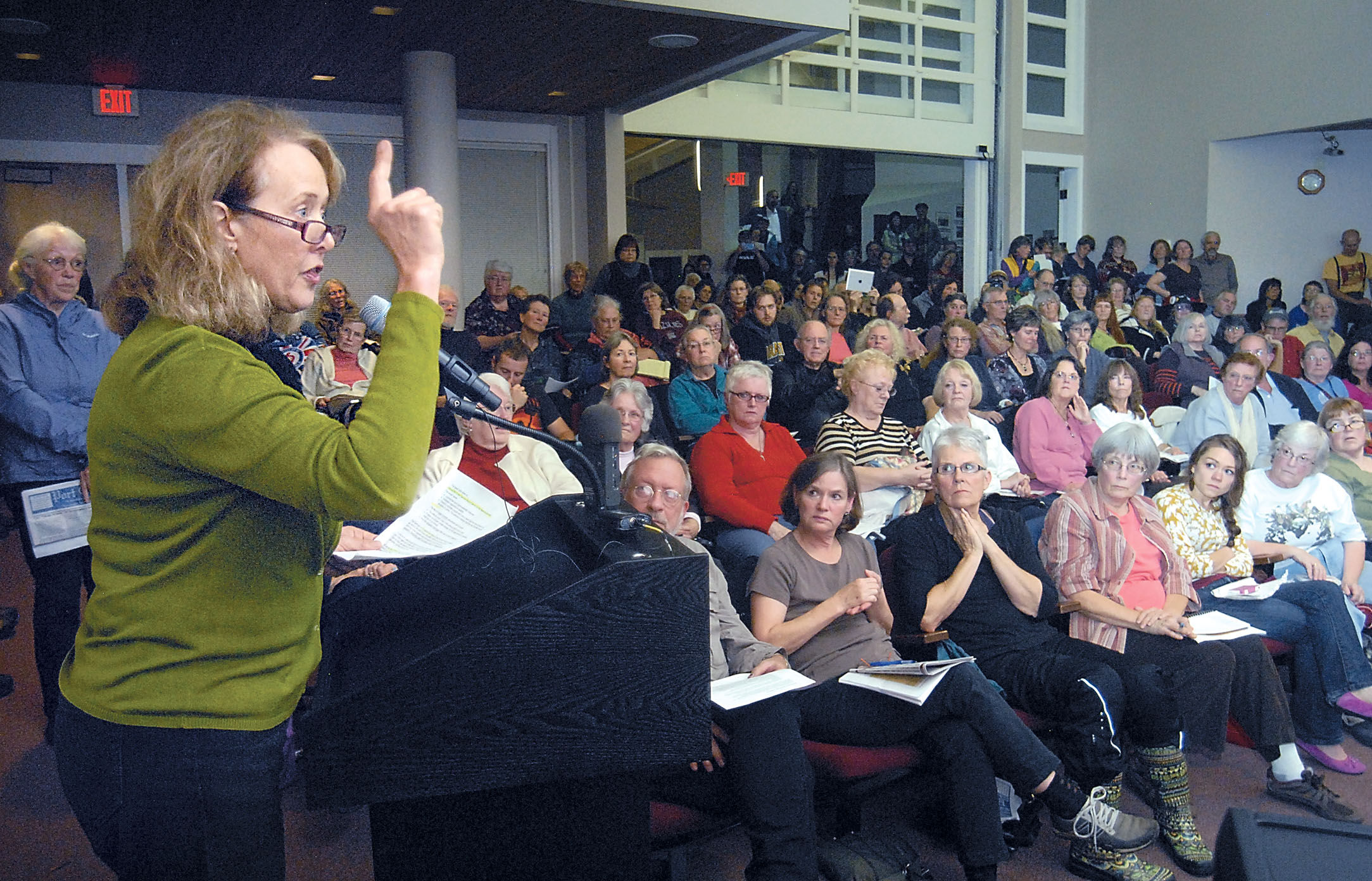 Beverly Goldie of Sequim expresses her opposition to a Navy proposal to perform electronic warfare training exercises in forests of the West End during a question-and-answer forum at Port Angeles City Hall. Keith Thorpe/Peninsula Daily News