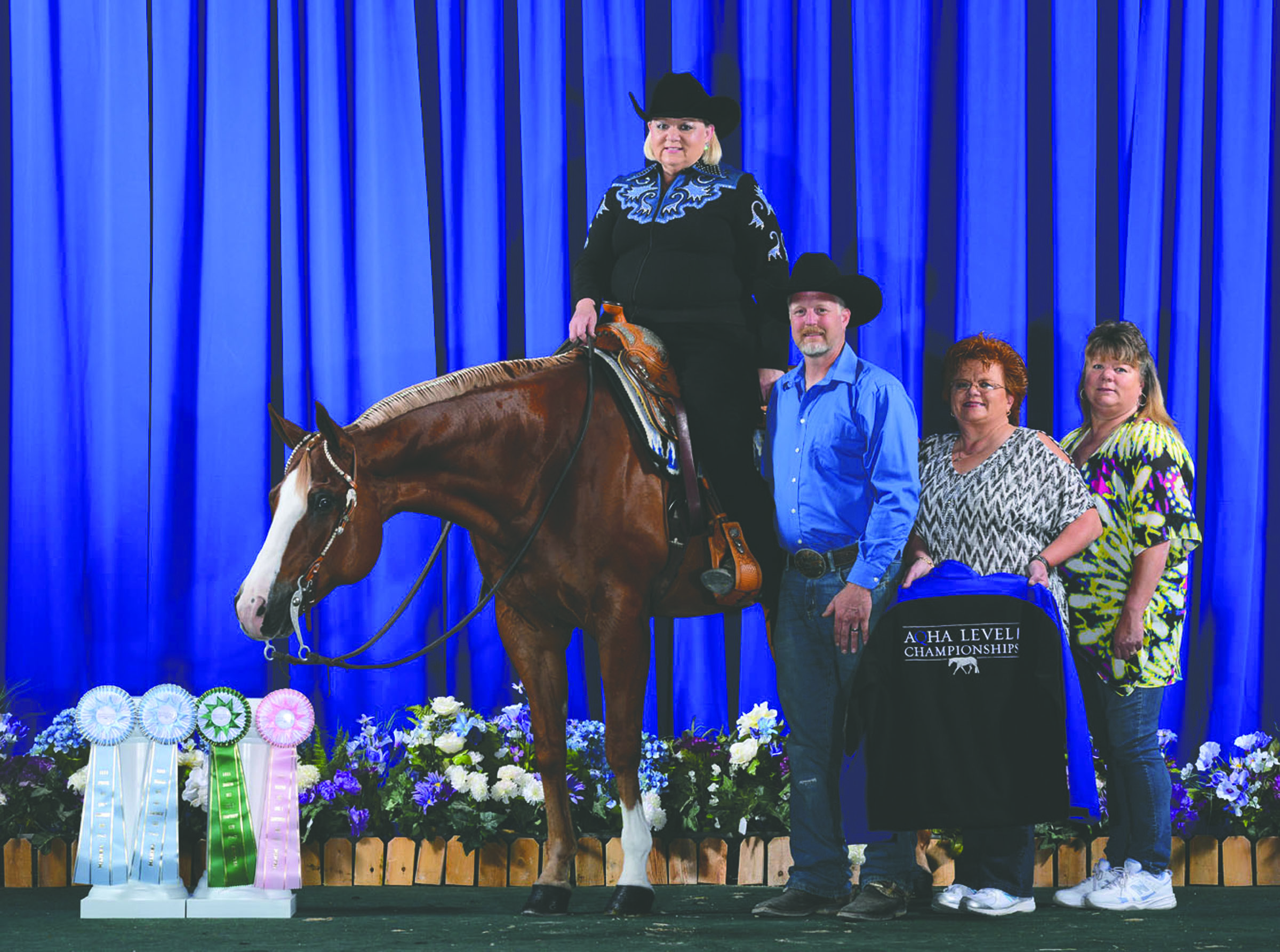 In the winner's circle from left is Port Angeles' Terri Winters atop Malibu