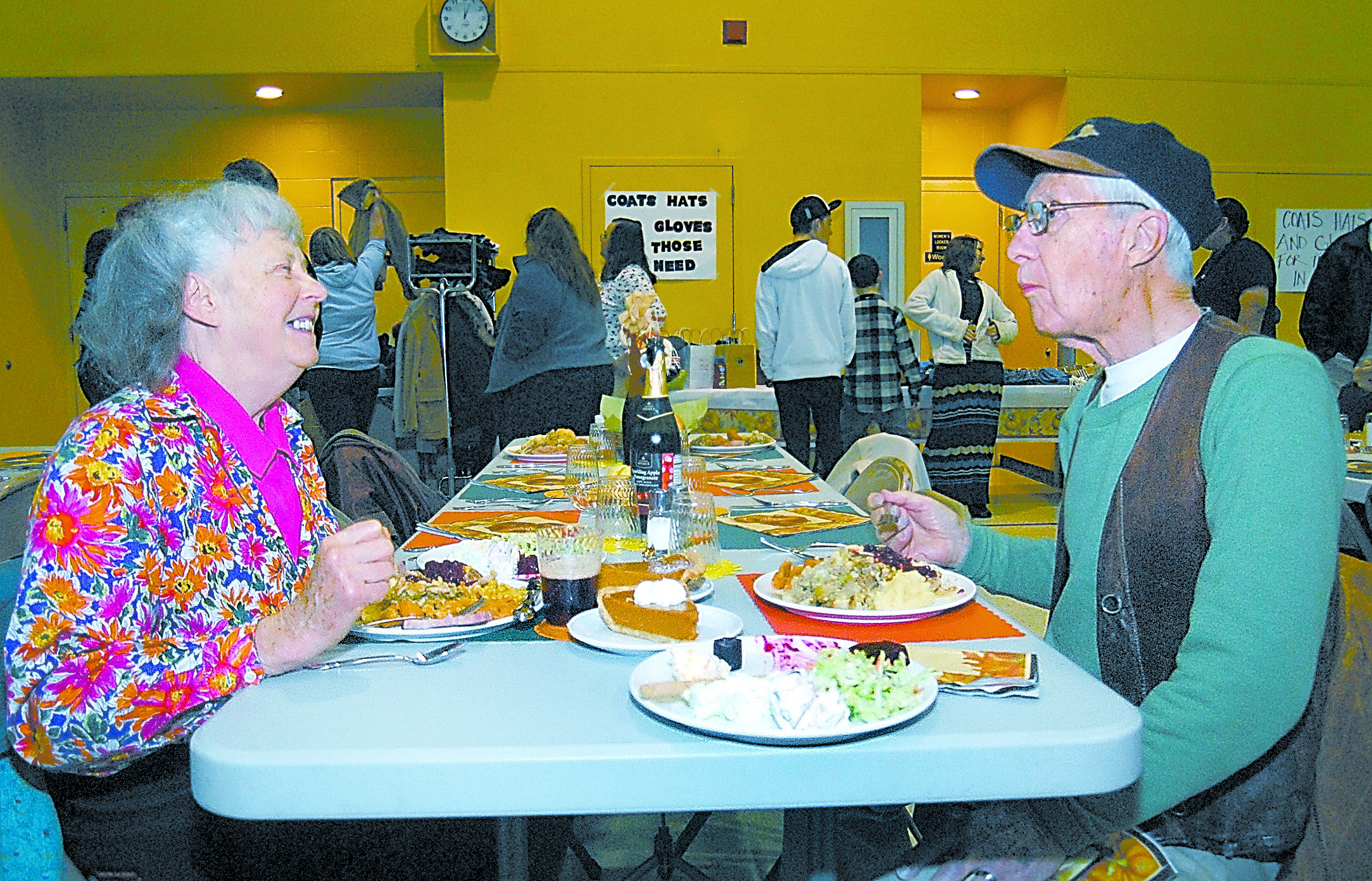 Joann and Chris Johnson of Port Angeles enjoy a free meal during last year's community dinner at Queen of Angels Church in Port Angeles. Keith Thorpe/Peninsula Daily News