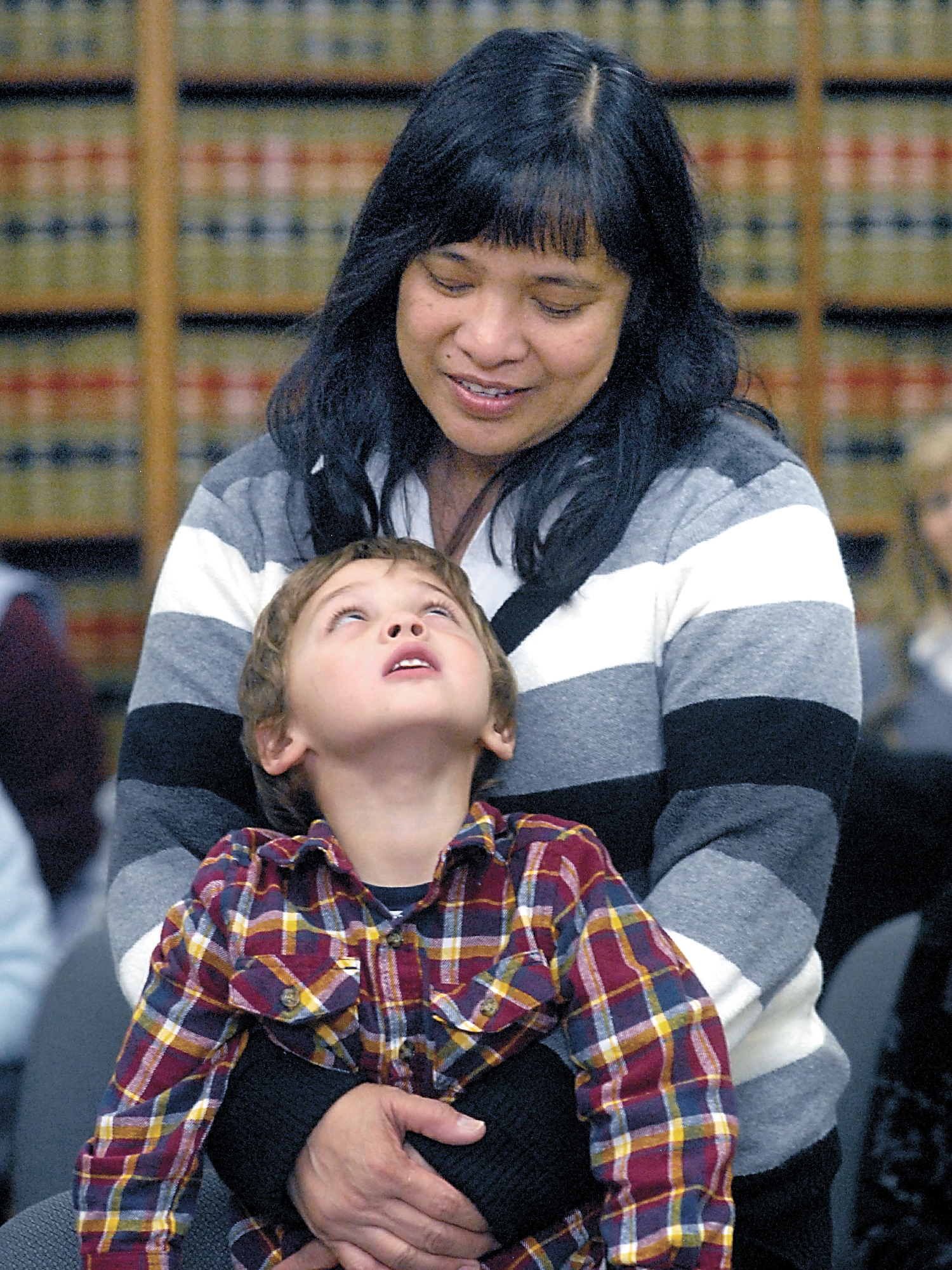 Evelyn Crane of Sequim looks down at her newly adopted son