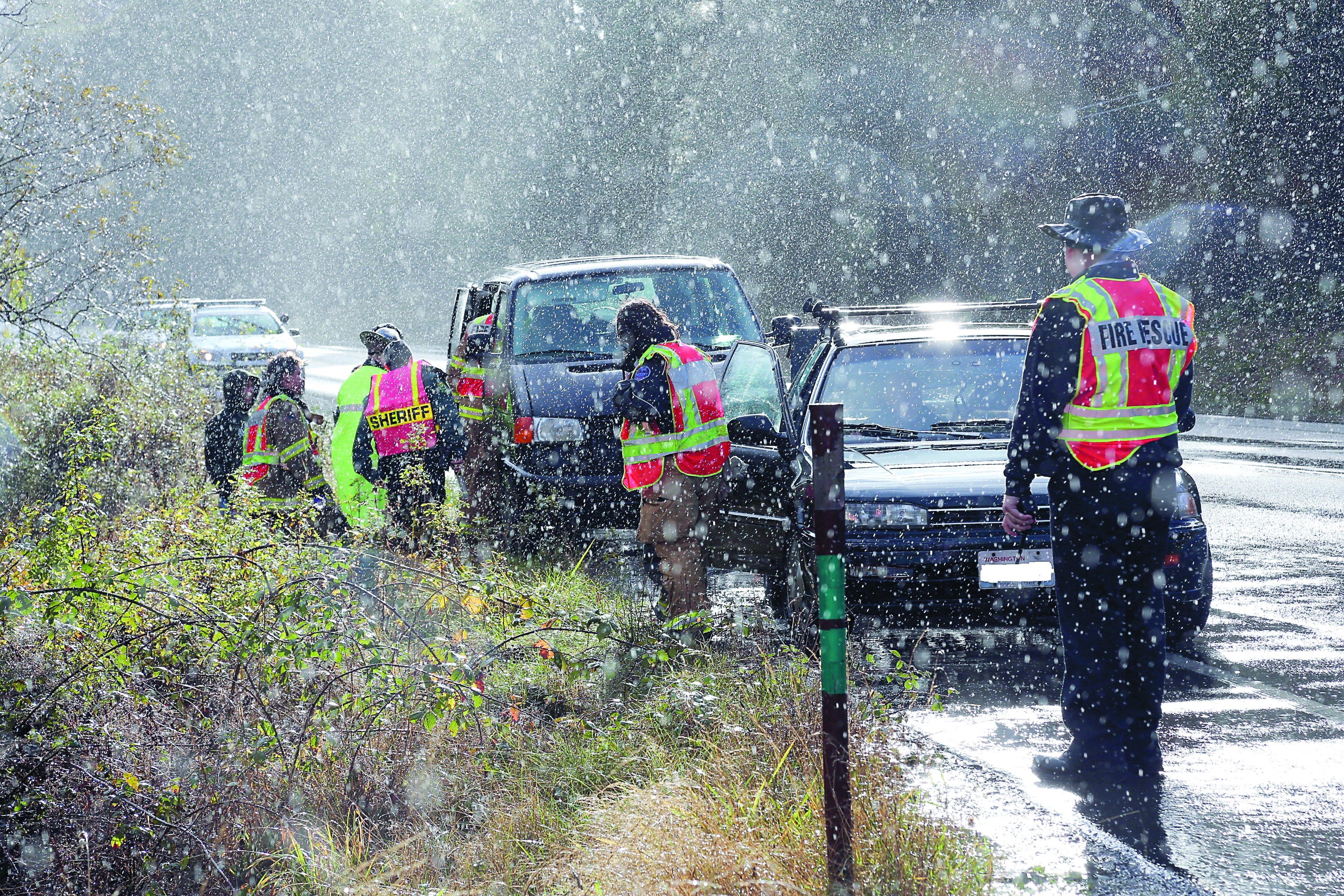 East Jefferson Fire-Rescue and Jefferson County Sheriff's Office personnel investigate a three-car wreck on state Highway 20 near Port Townsend on Tuesday. Crystal Craig