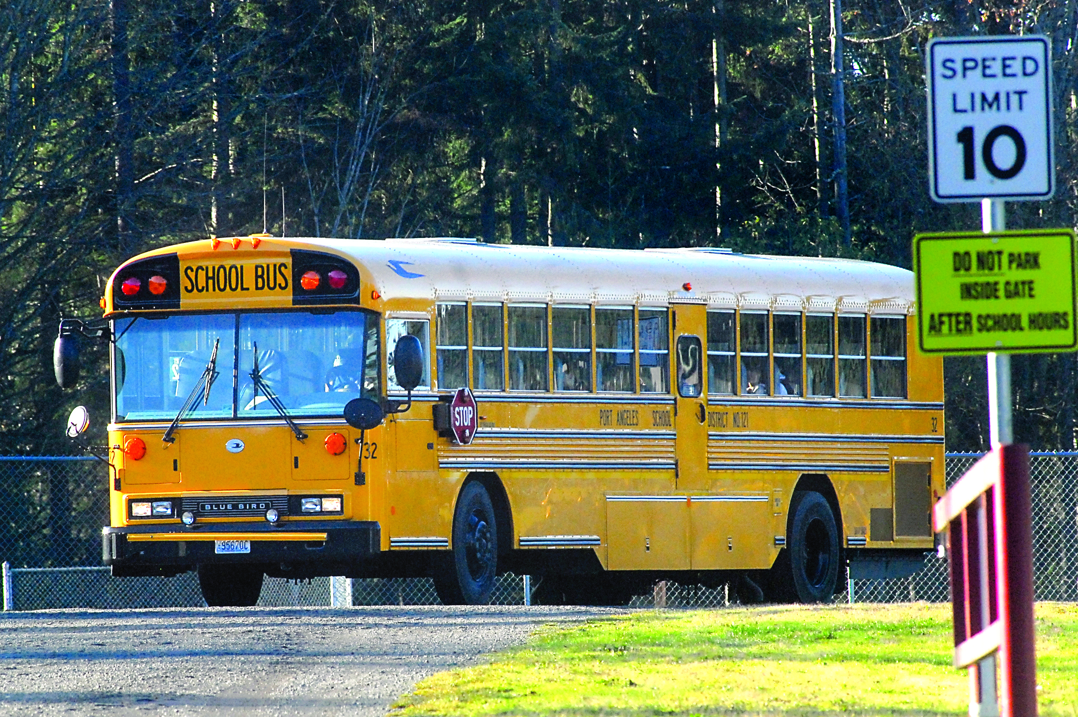 A Port Angeles School District bus pulls away from Roosevelt Elementary School on normal schedule Tuesday afternoon.  —Photo by Keith Thorpe/Peninsula Daily News