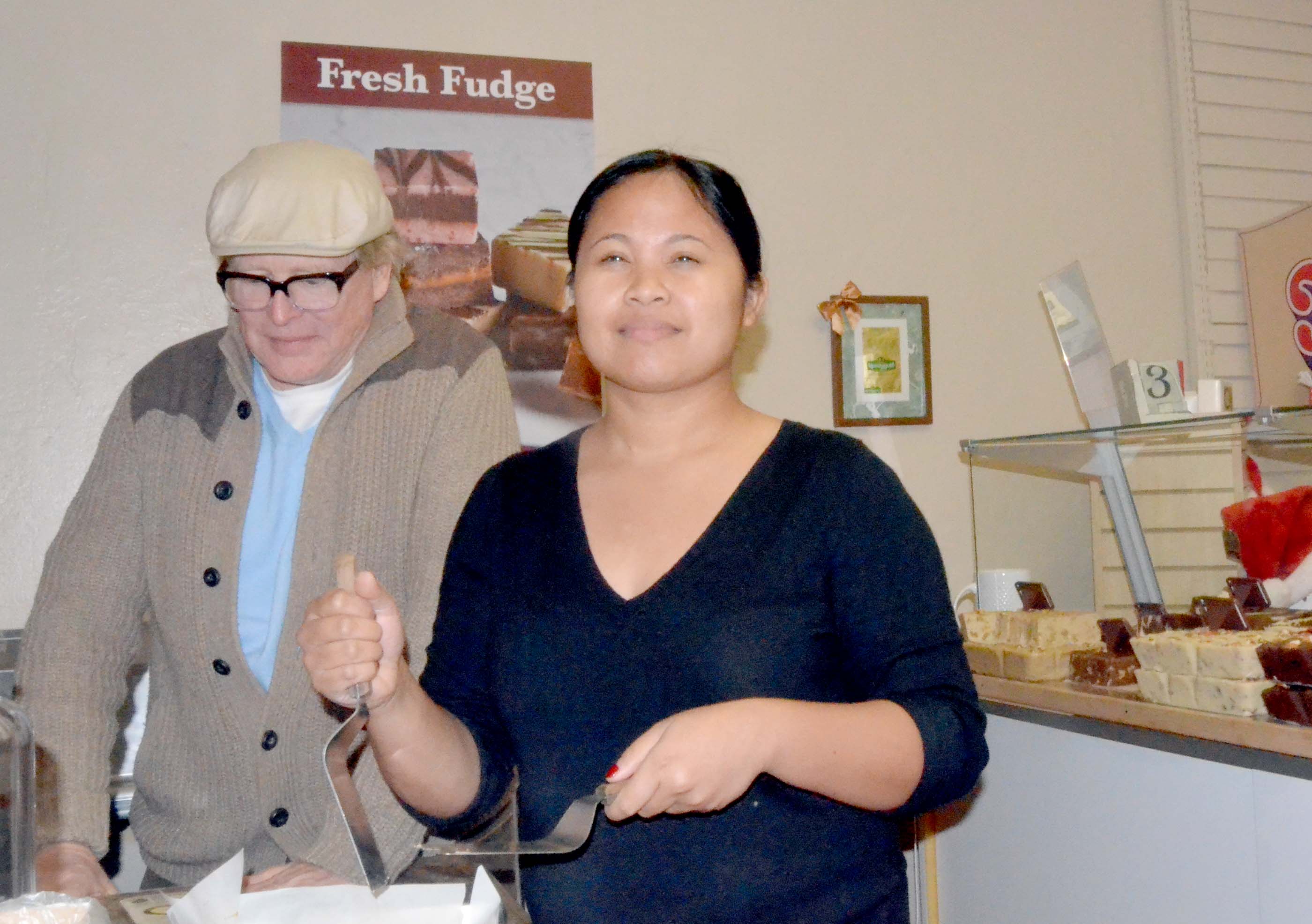 Tim and Harline Moyer in their fudge shop in Port Angeles that will close after Christmas Eve until next spring. Charlie Bermant/Peninsula Daily News