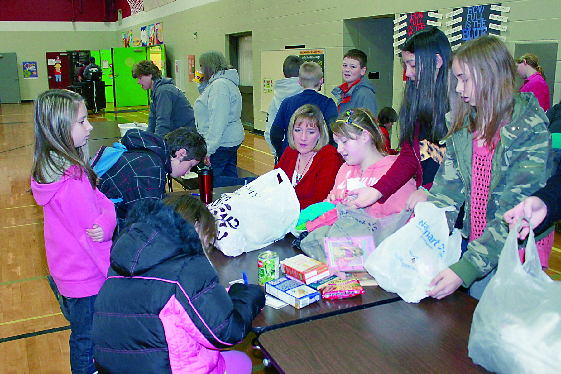 Collecting items before classes started at Roosevelt Elementary School in Port Angeles last week are Jenna Gates