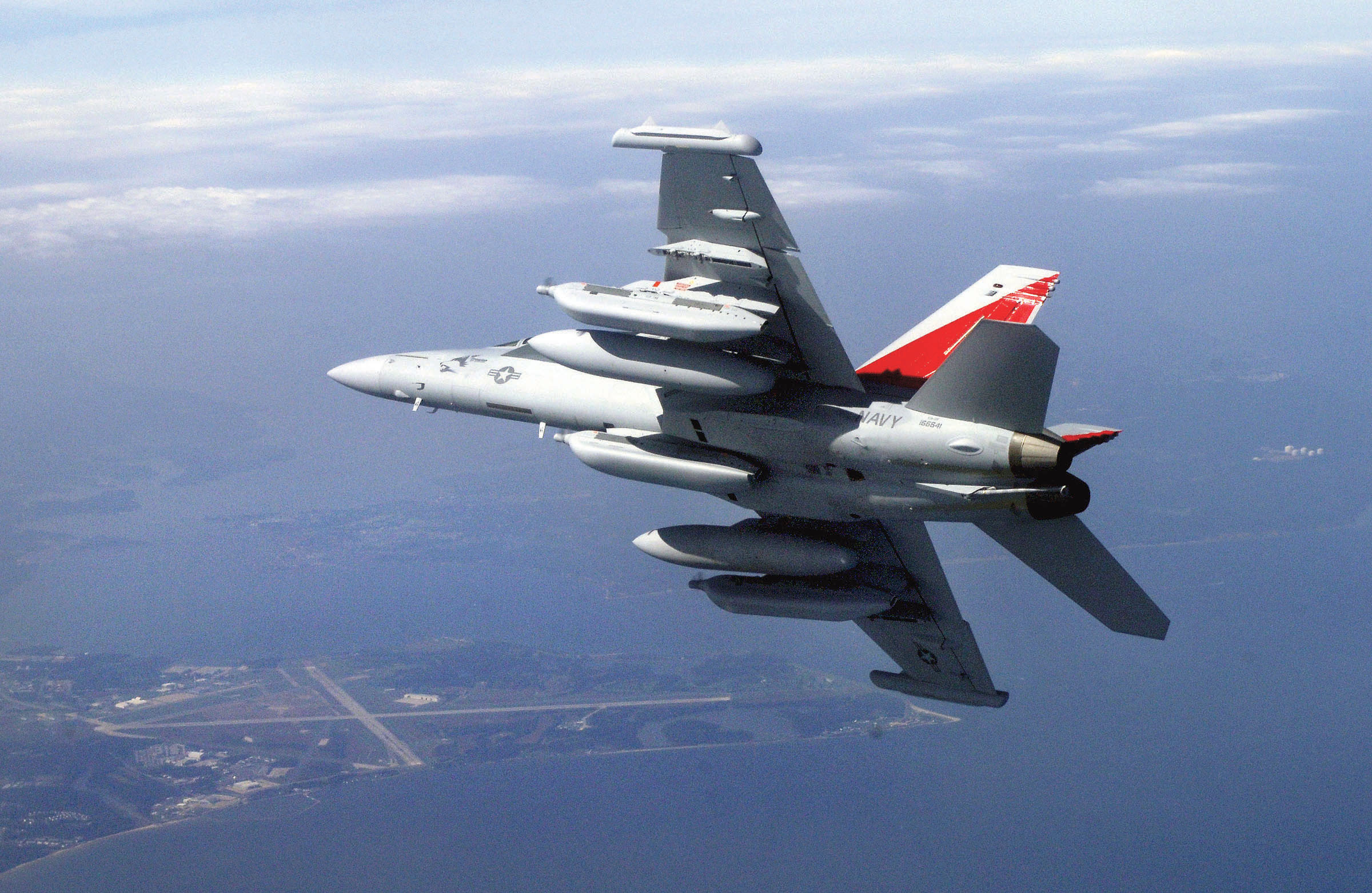 A Navy EA-18G Growler like those based at Naval Air Station Whidbey Island is capable of landing on and taking off from aircraft carriers.  —U.S. Navy photo