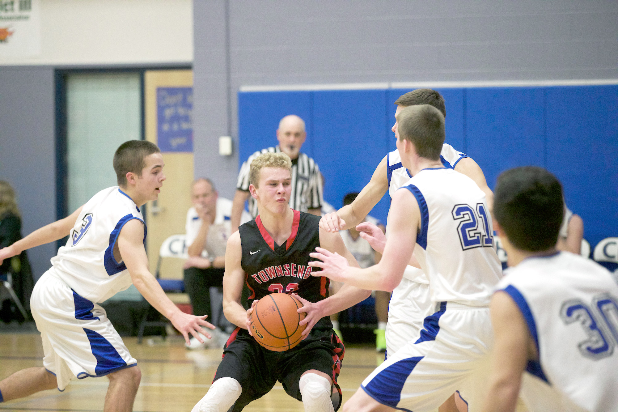 Port Townsend's Patrick Charlton (with ball) has nowhere to go while being surrounded by Cowboys Christopher Bainbridge (3)