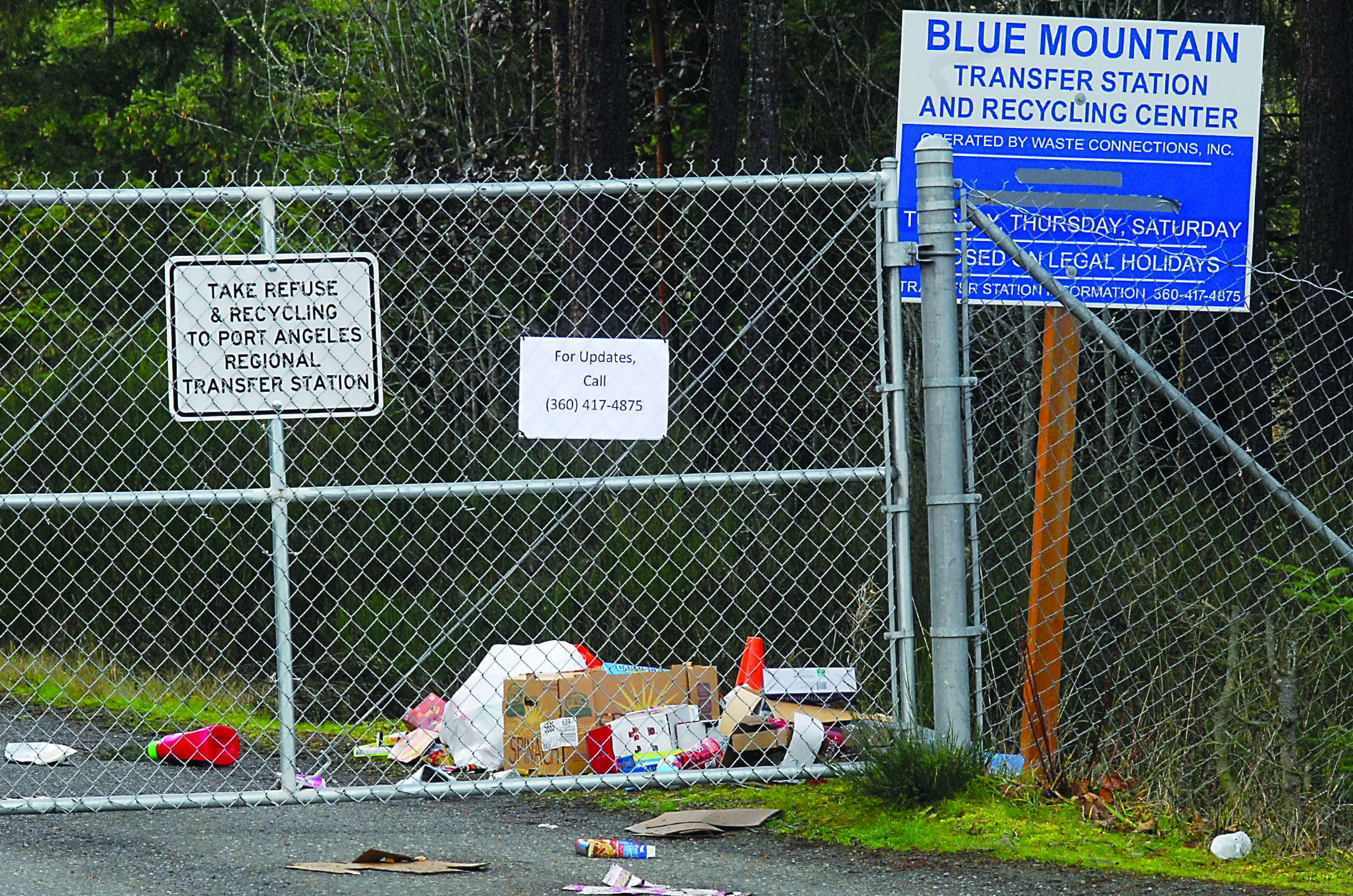 A pile of refuse sits behind the front gate of the shuttered Blue Mountain Transfer Station on Blue Mountain Road east of Port Angeles on Thursday. — Keith Thorpe/Peninsula Daily News