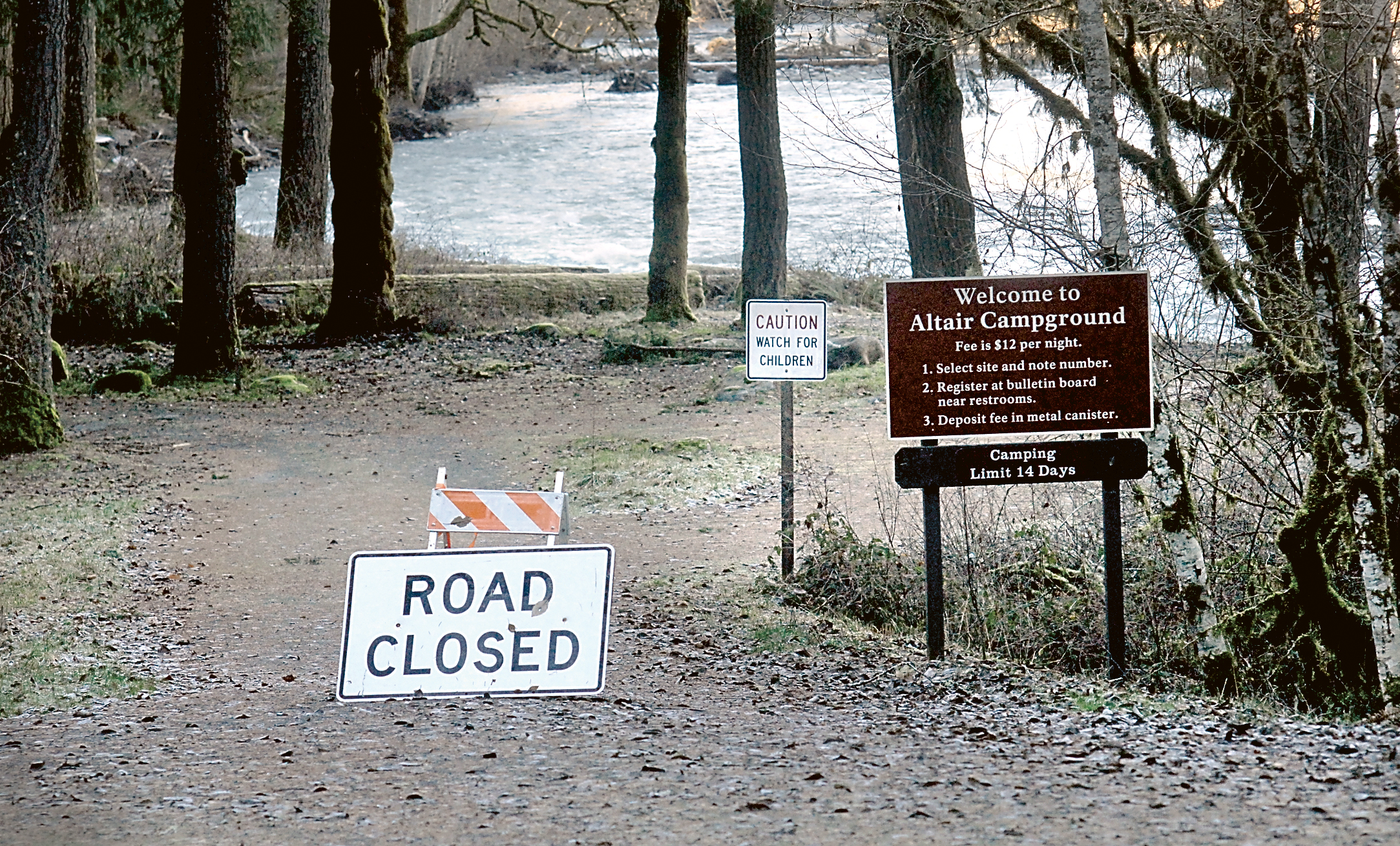 A road closed sign marks a portion of the loop road through the Altair Campground in Olympic National Park on Wednesday. The Elwha River