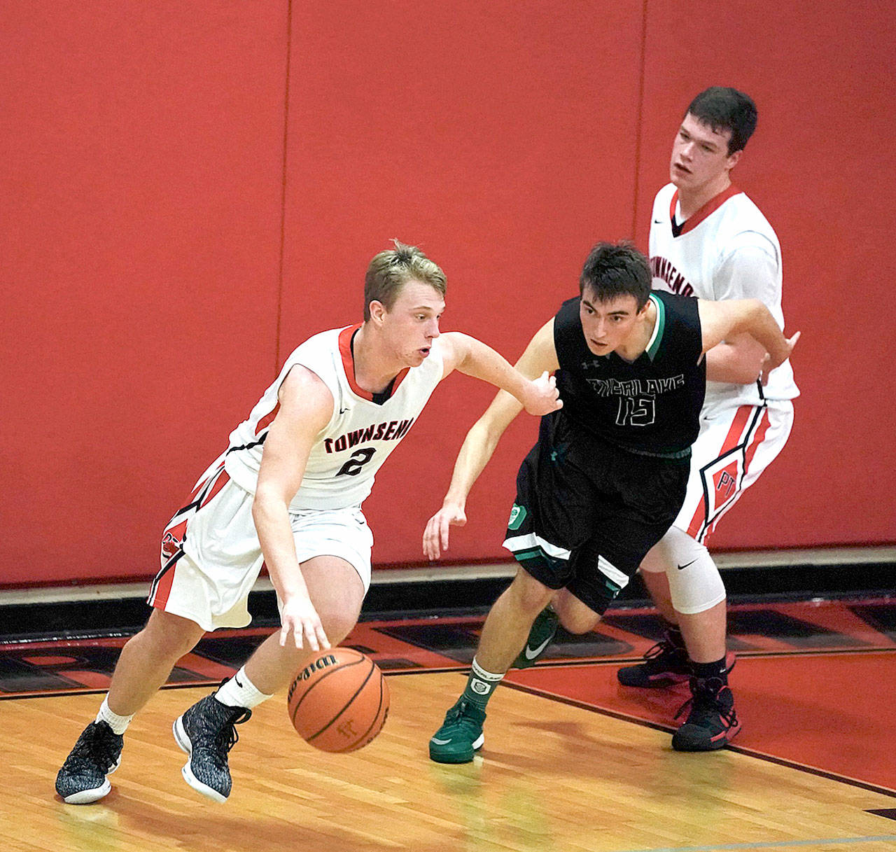 Steve Mullensky/for Peninsula Daily News Port Townsend Redhawk Kaiden Parcher breaks for the basket during a Crush in the Slush game against the Overlake Owls on Saturday at the high school.