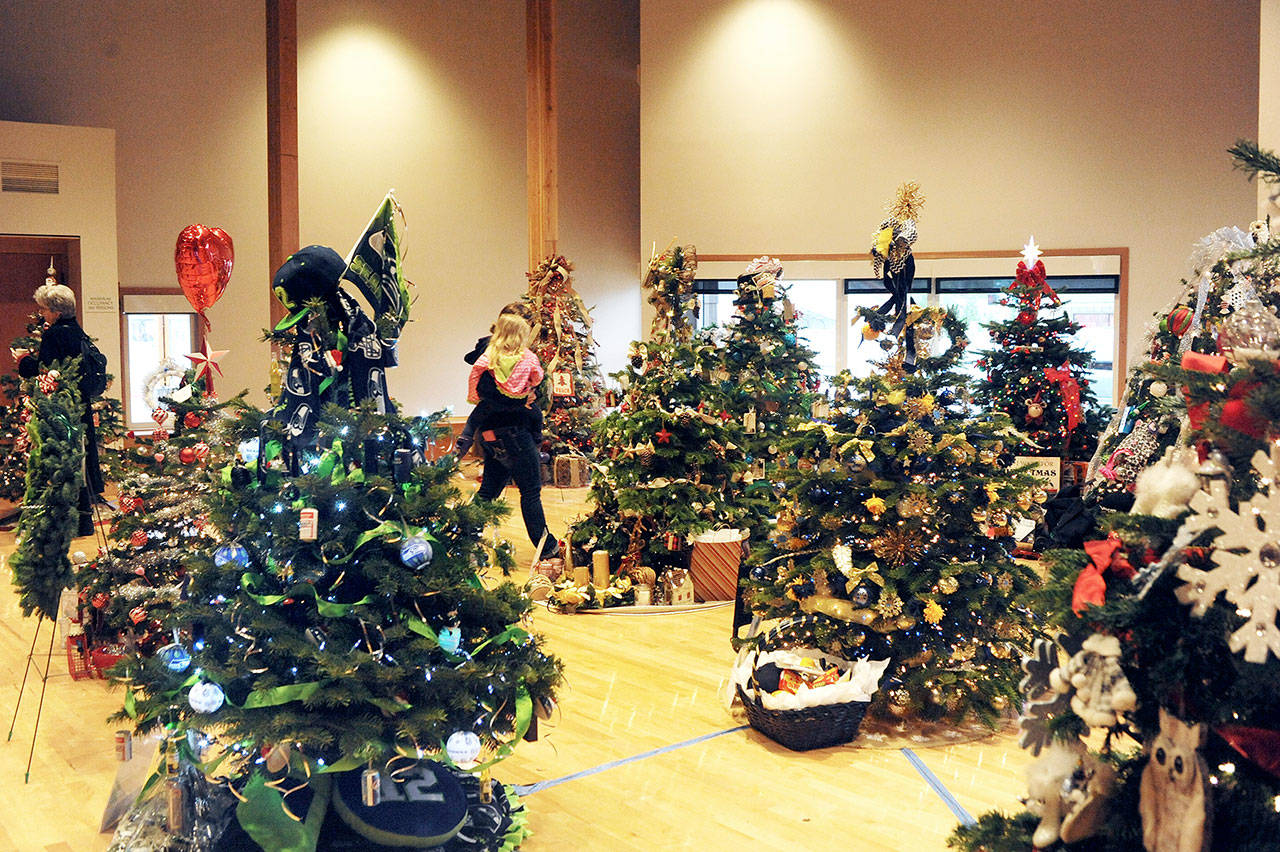 Trees such as these from last year’s Forks Festival of Trees will be auctioned off this weekend. (Lonnie Archibald/for Peninsula Daily News)