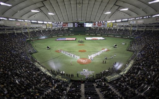 Flags of the United States and Japan are carried during the opening ceremony of the American League season opening MLB baseball game between the Oakland Athletics and the Seattle Mariners at Tokyo Dome in Tokyo this morning Pacific time. The Associated Press