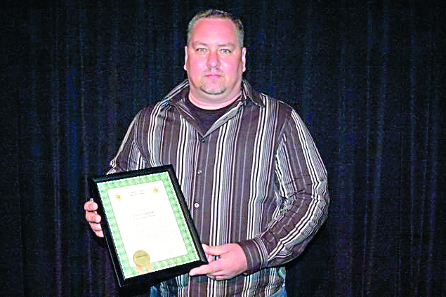 Steven Brooks with his Employee of the Year award.