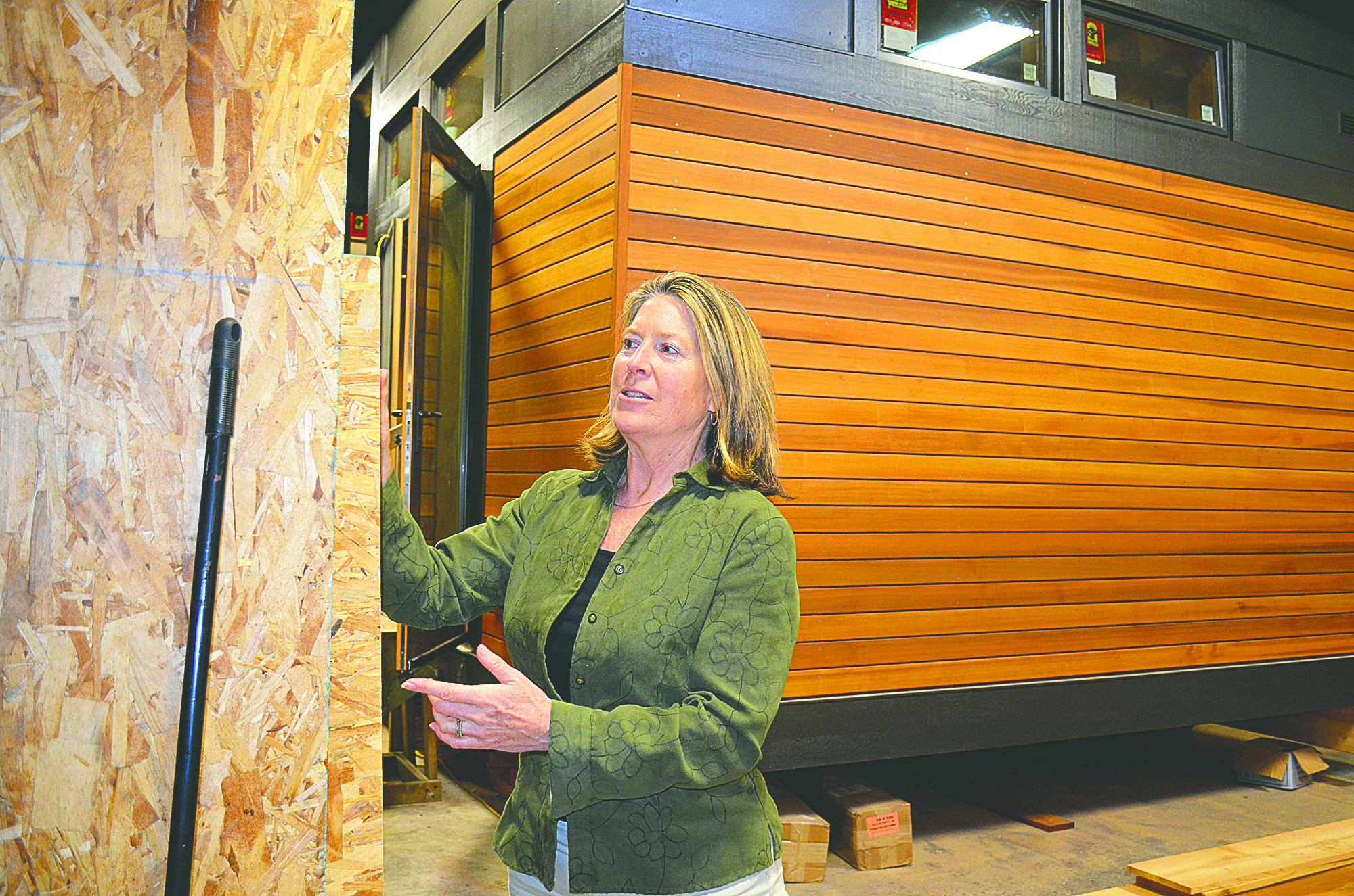 Greenpod owner Ann Raab puts finishing touches on a home that will be displayed at the Seattle Green Home Tour later this month. The pod will also be displayed at two studio tours on April 7 and April 14. Charlie Bermant/Peninsula Daily News