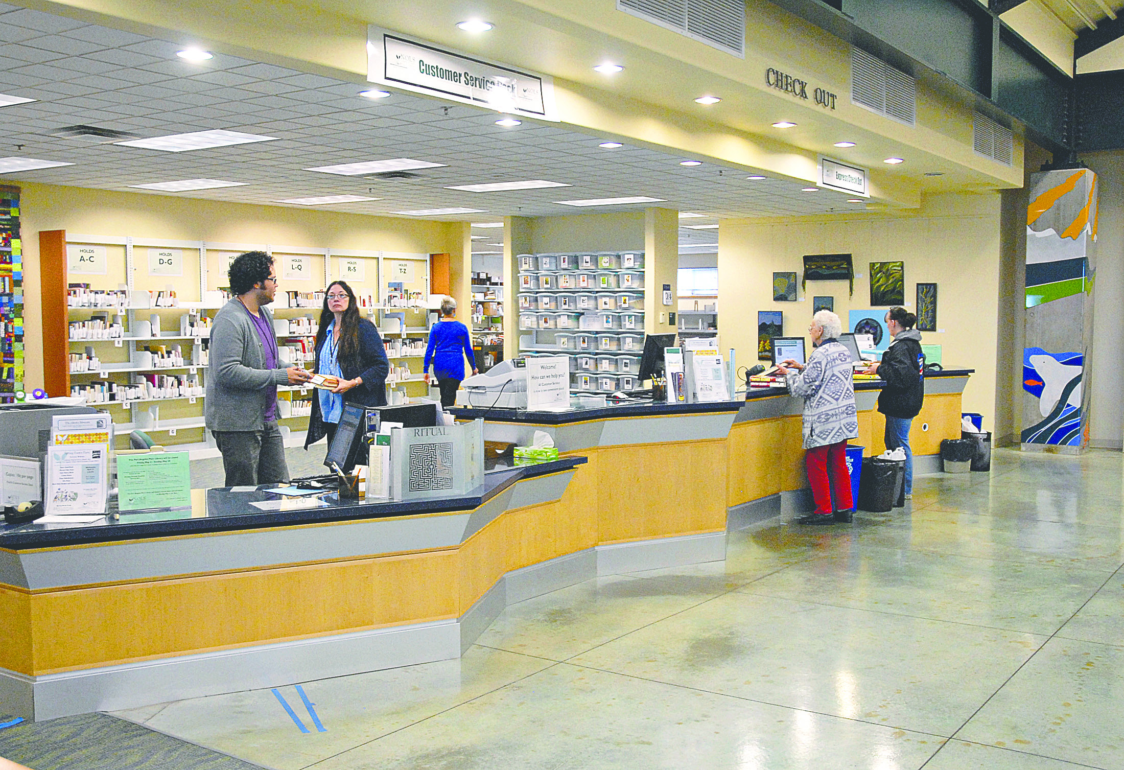 The front desk at the Port Angeles Main Library of the North Olympic Library System will be replaced as part of a reconfiguration in early May. Chris Tucker/Peninsula Daily News