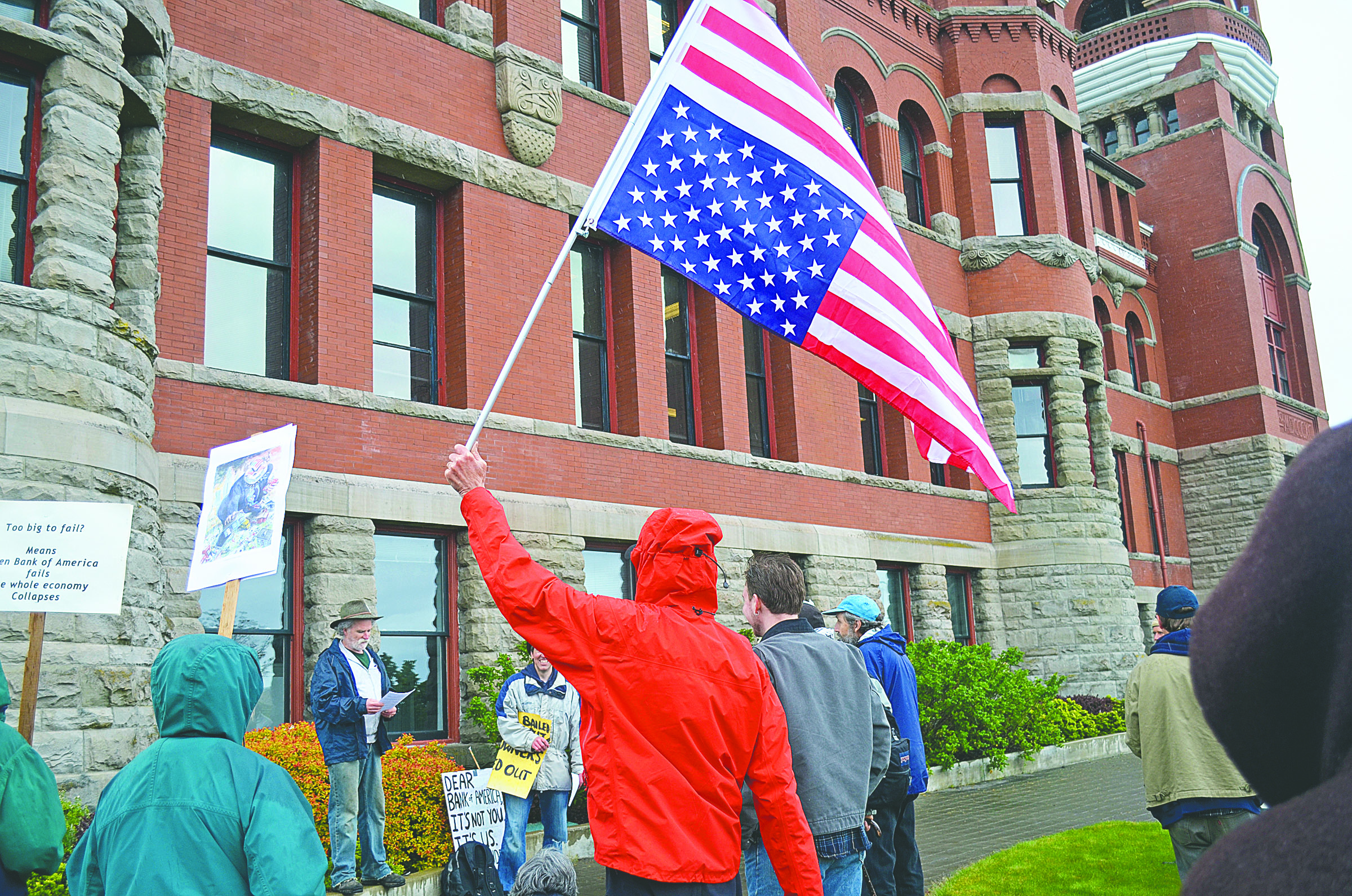 About 40 demonstrators converged on the Jefferson County Courthouse in Port Townsend to demand that the county close its accounts at Bank of America. Charlie Bermant/Peninsula Daily News