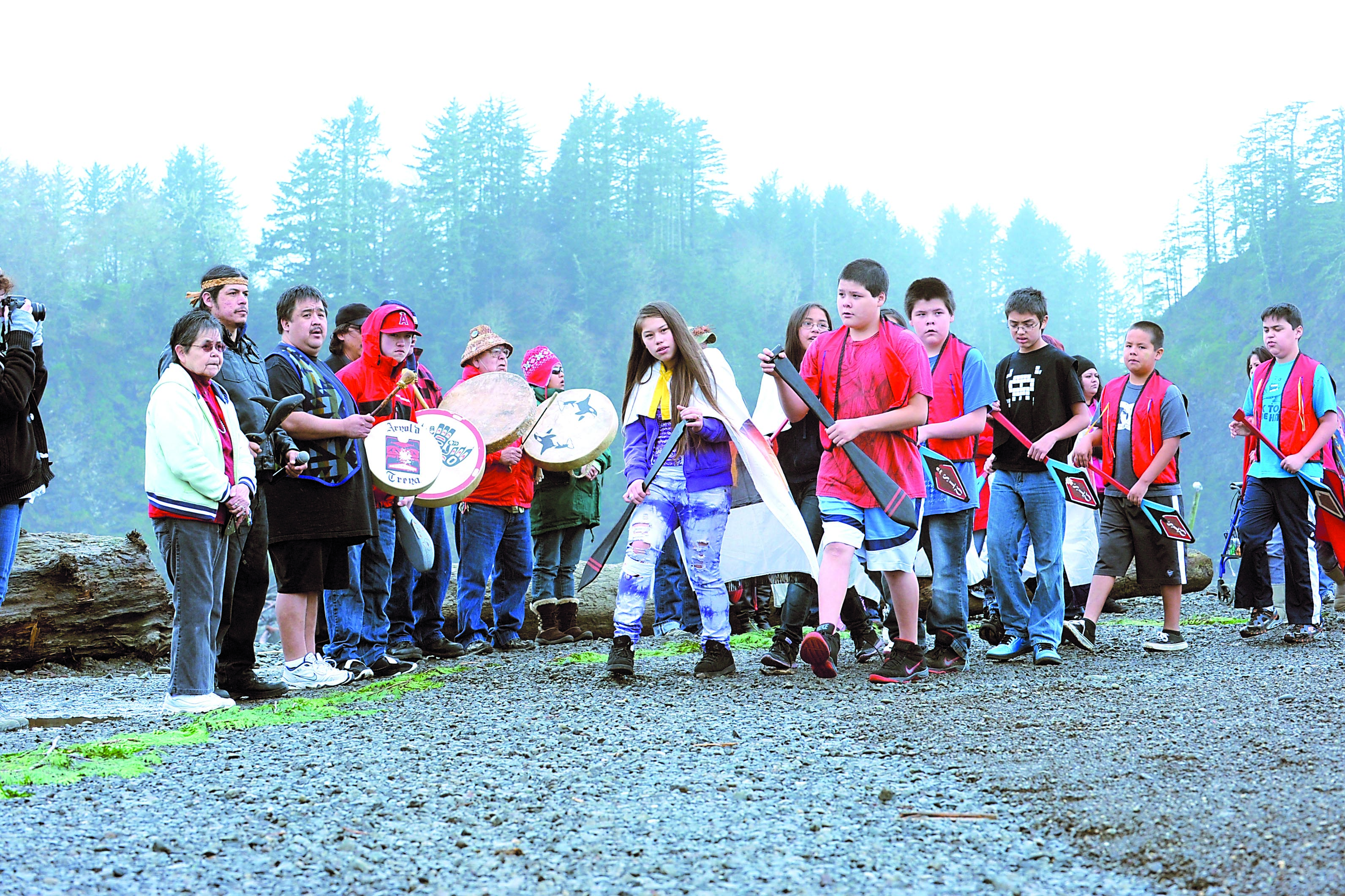 Quileute Tribal School dancers and tribal drummers perform Saturday morning above First Beach at LaPush during the fifth annual whale welcoming ceremony. James Island is in the background. Lonnie Archibald/for Peninsula Daily News