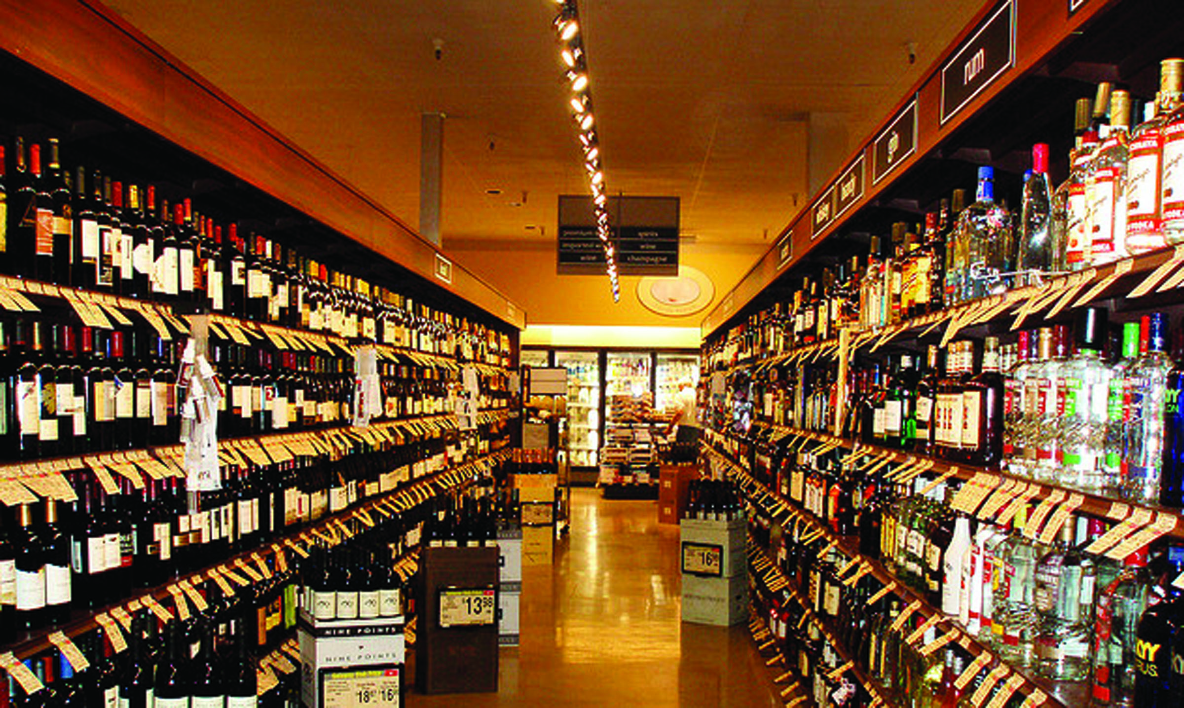 Shelves displaying hard liquor for sale are shown in this California Safeway store. Safeway stores on the North Olympic Peninsula are among outlets selling spirits for the first time in Washington state history today.  -- Special to Peninsula Daily News