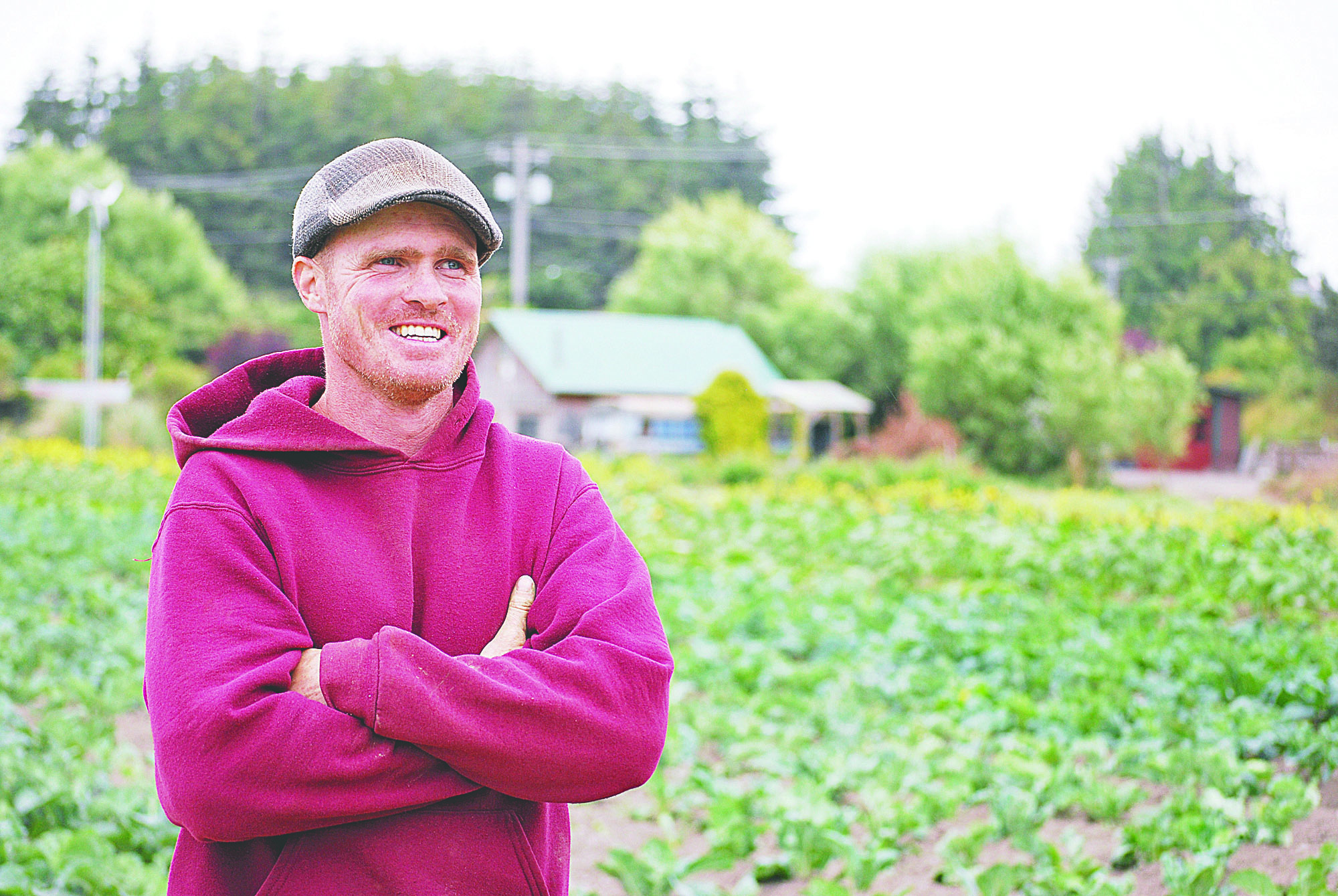 Patrick Drum stands in a Nash’s Organic Produce field